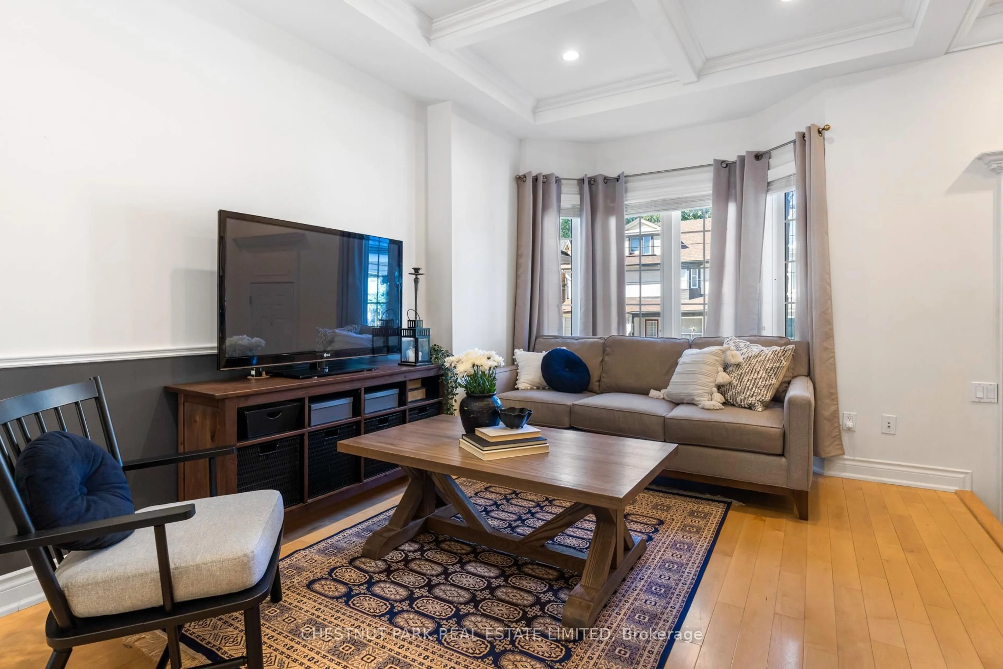 Living room with furniture, unknown for 129 Jones Ave, Toronto Ontario M4M 2Z7