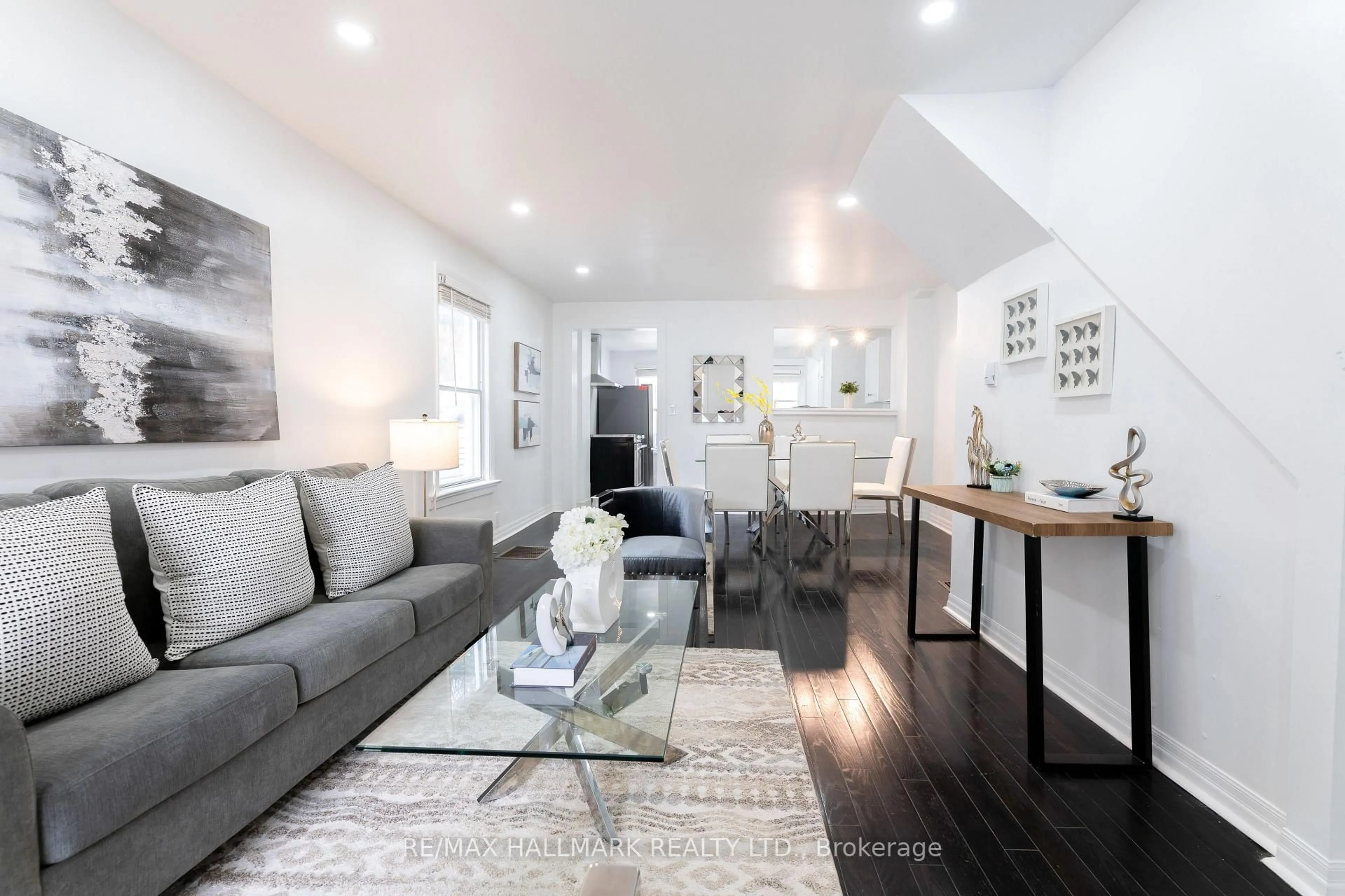 Living room with furniture, wood/laminate floor for 106 Willow Ave, Toronto Ontario M4E 3K3