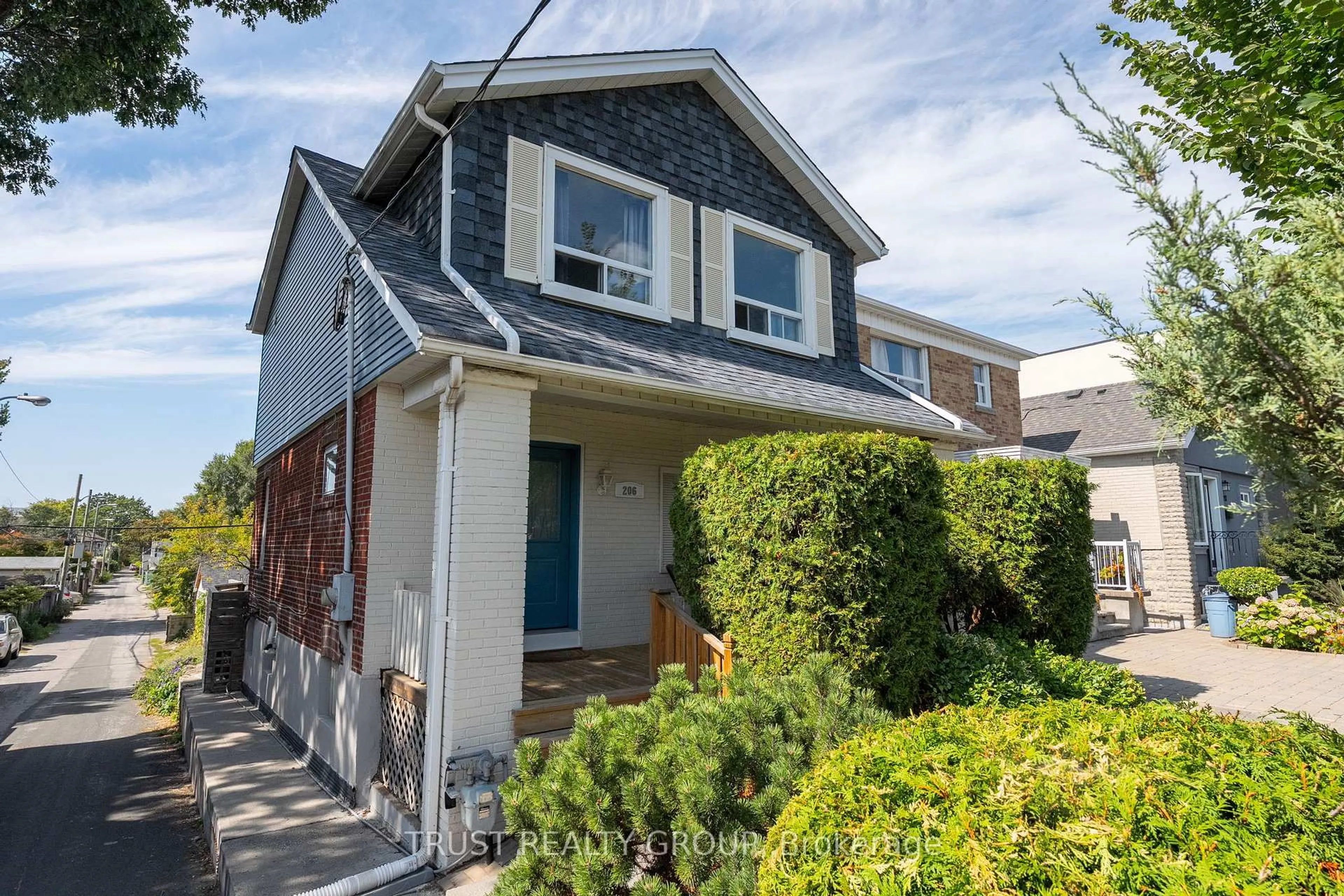 Home with vinyl exterior material, street for 206 Woodmount Ave, Toronto Ontario M4C 3Z6