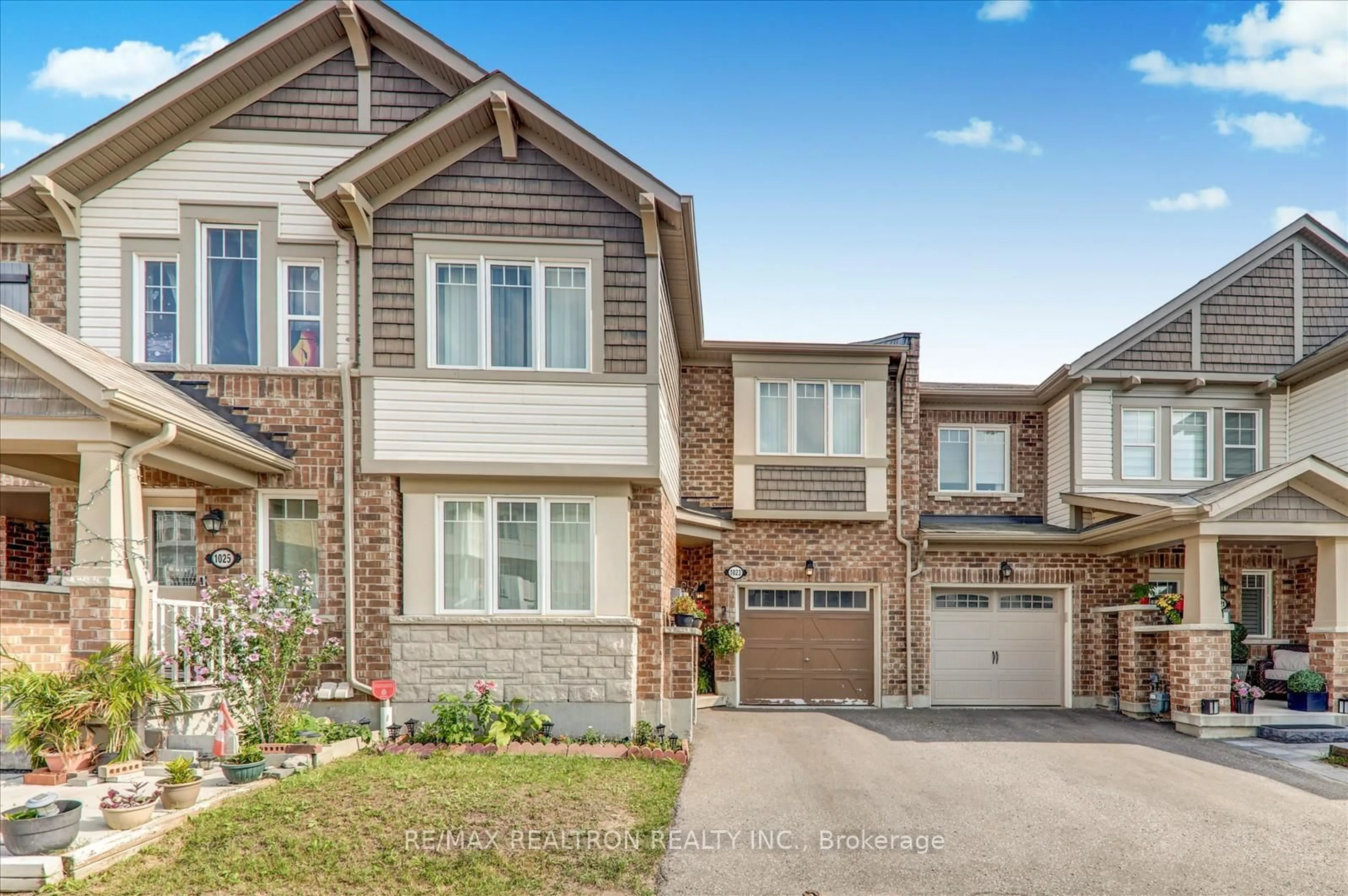 Home with brick exterior material, street for 1023 Dragonfly Ave, Pickering Ontario L1X 0E9
