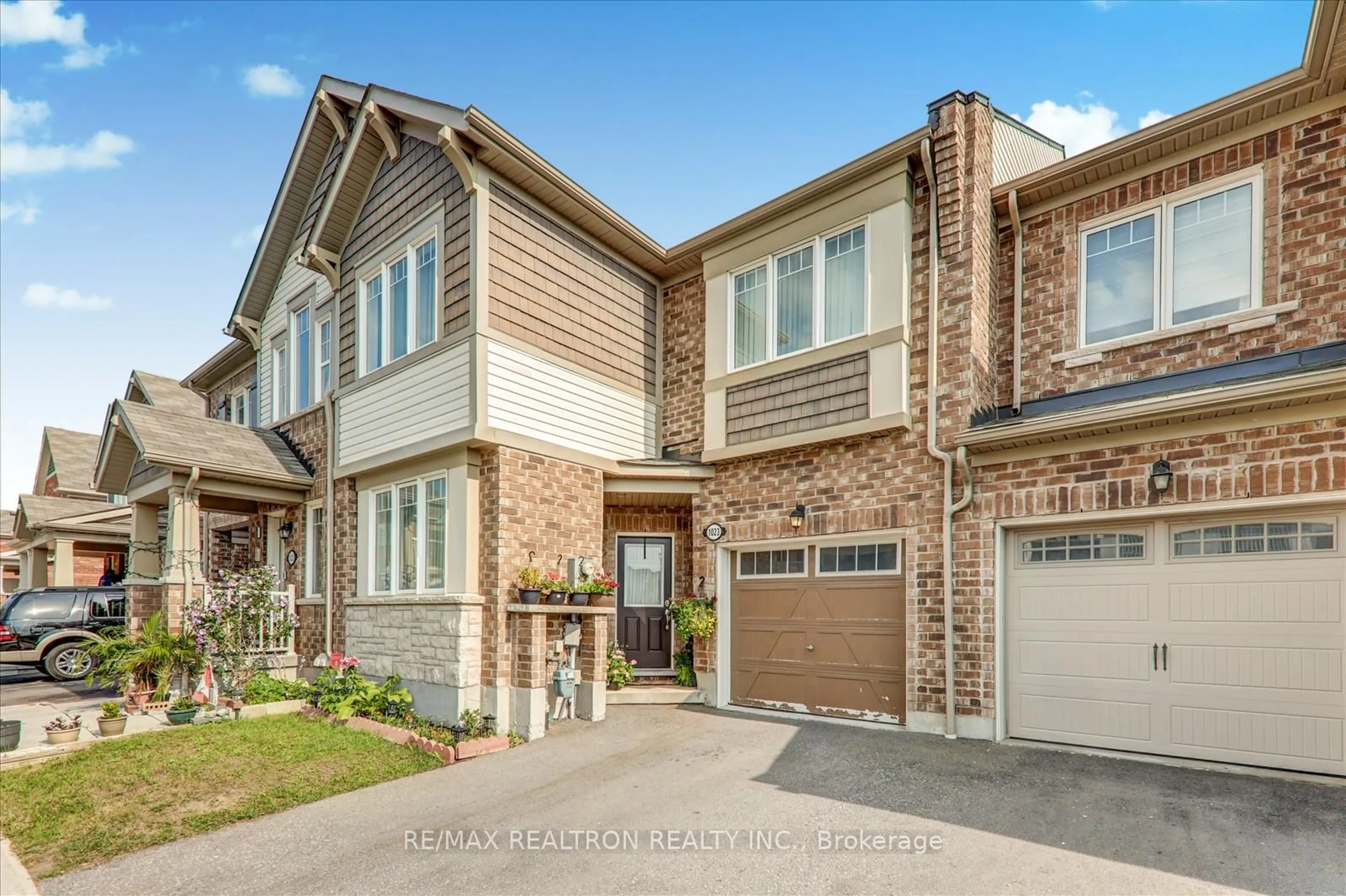 Home with brick exterior material, street for 1023 Dragonfly Ave, Pickering Ontario L1X 0E9