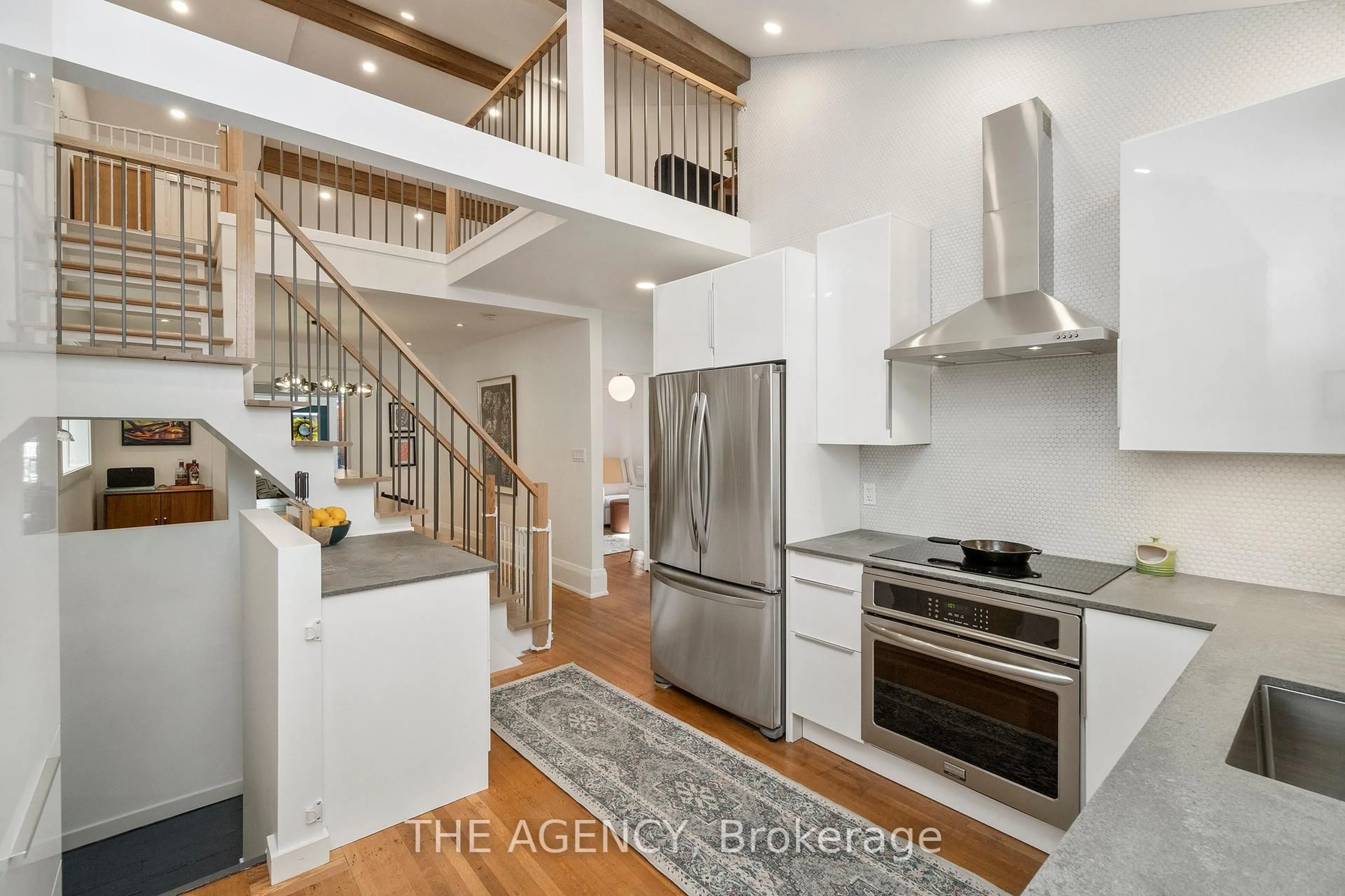Open concept kitchen, wood/laminate floor for 172 Brookside Dr, Toronto Ontario M4E 2M4