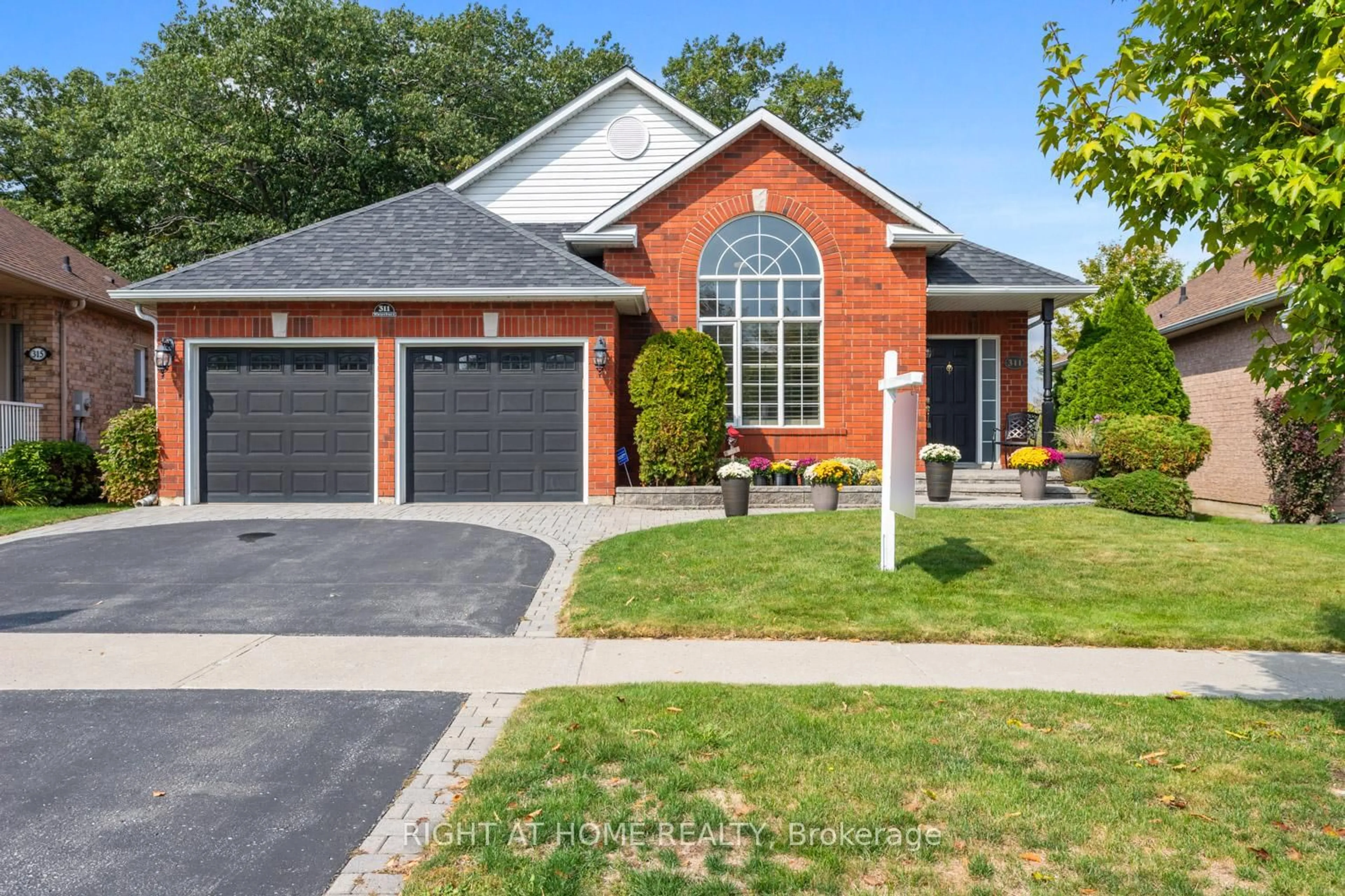 Home with brick exterior material, street for 311 Waterbury Cres, Scugog Ontario L9L 1S5