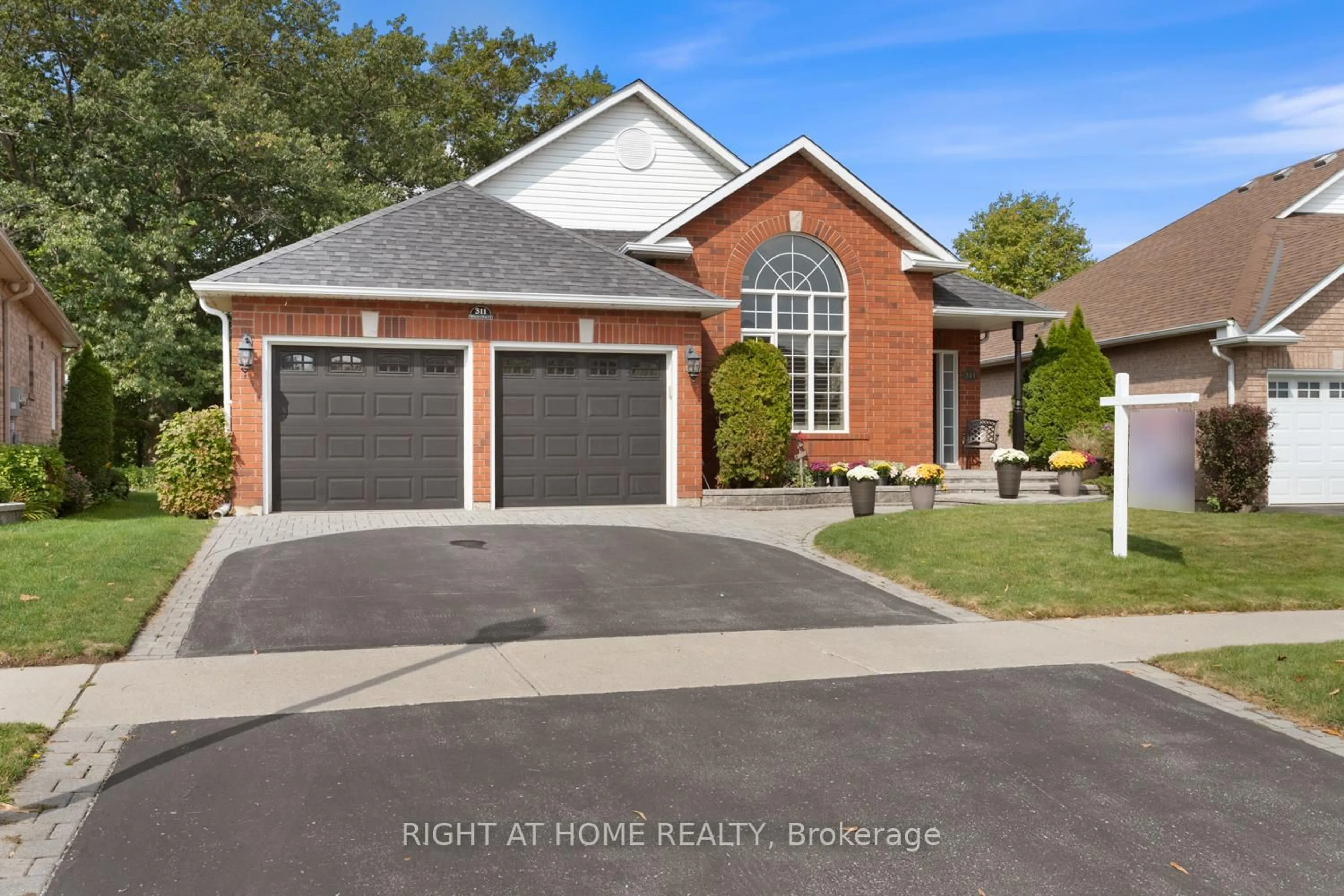 Home with brick exterior material, street for 311 Waterbury Cres, Scugog Ontario L9L 1S5