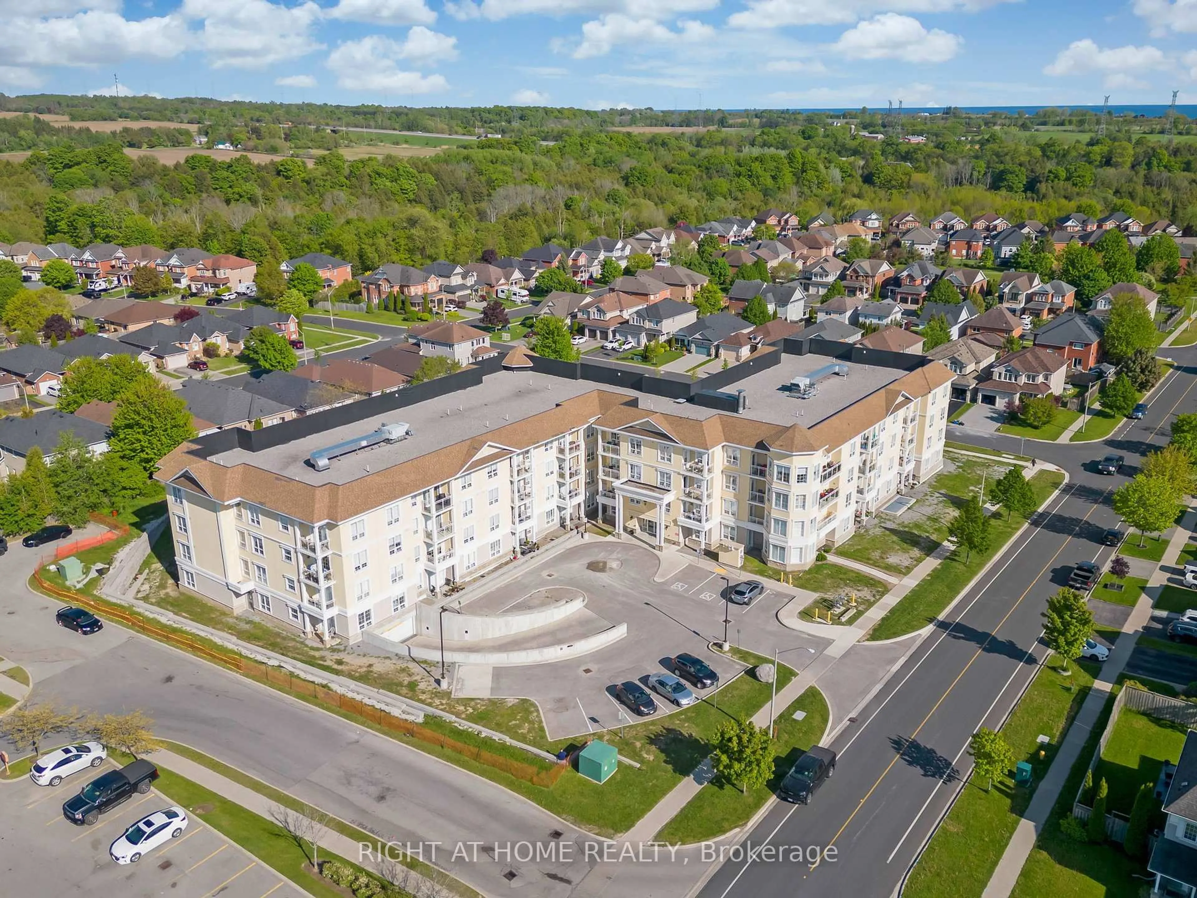 A pic from outside/outdoor area/front of a property/back of a property/a pic from drone, unknown for 21 Brookhouse Dr #412, Clarington Ontario L1B 0V4
