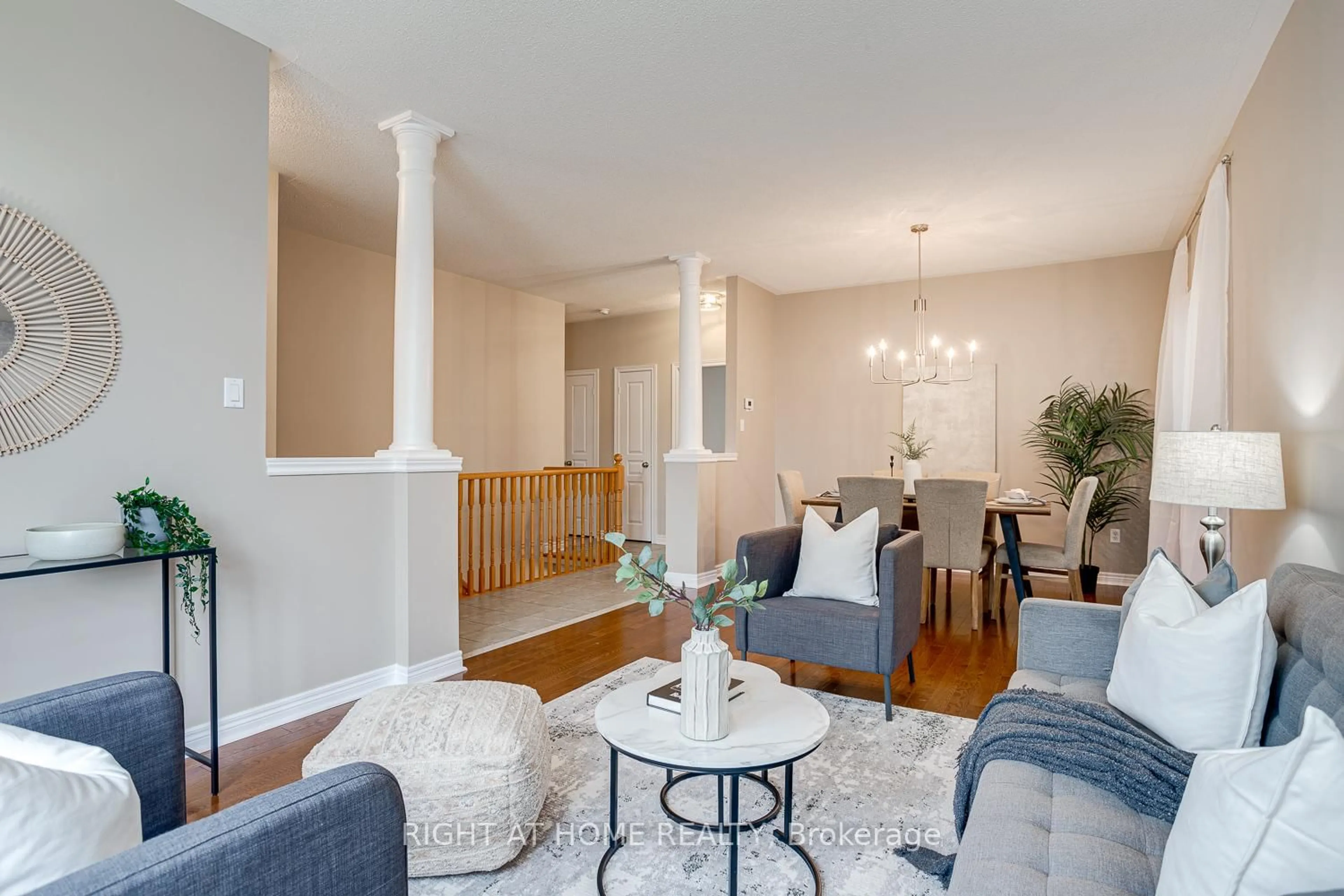 Living room with furniture, wood/laminate floor for 100 Earl Cuddie Blvd, Scugog Ontario L9L 1T3