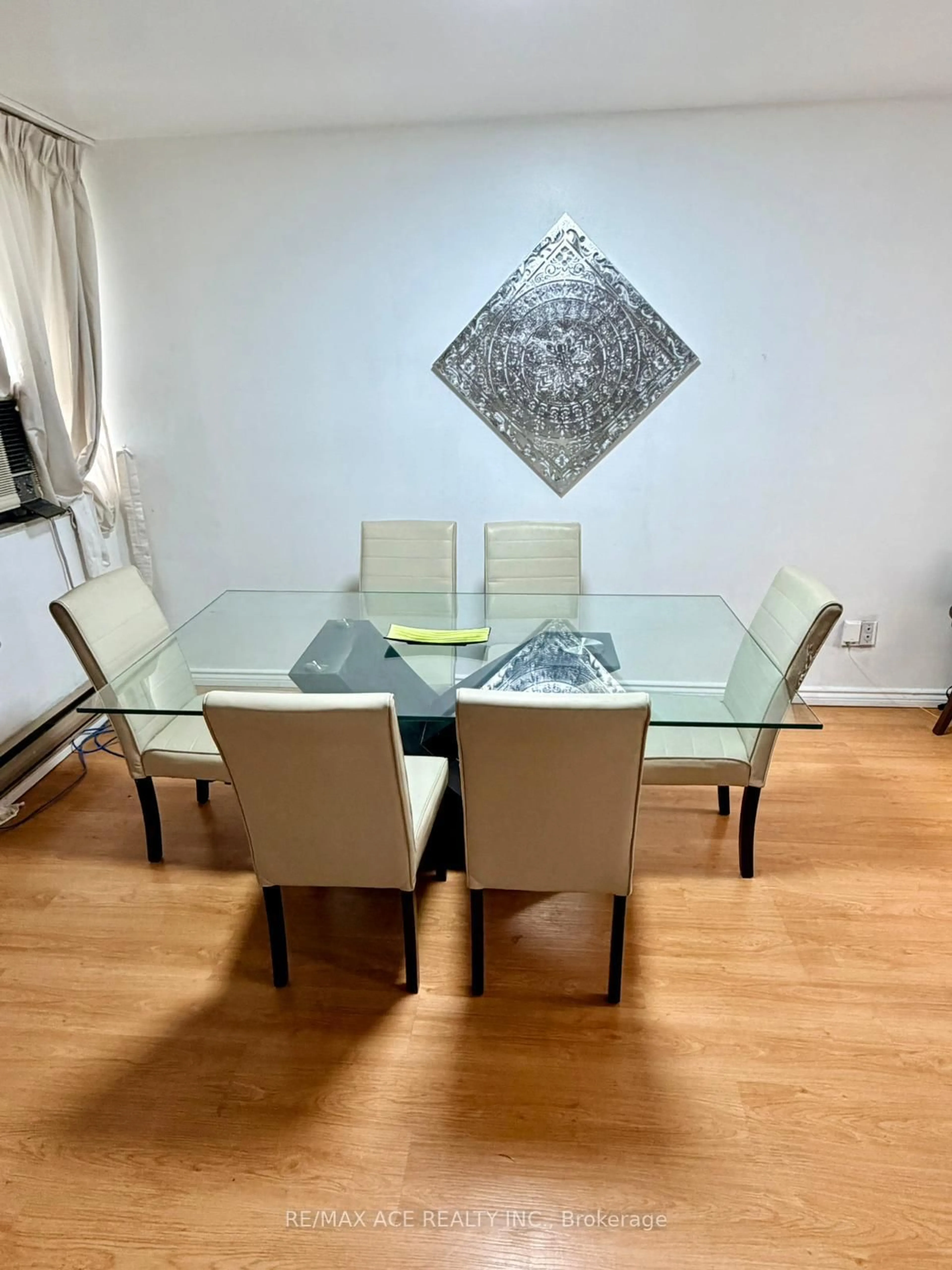 Dining room, wood/laminate floor for 10 Crescent Town Rd #303, Toronto Ontario M4C 5L3