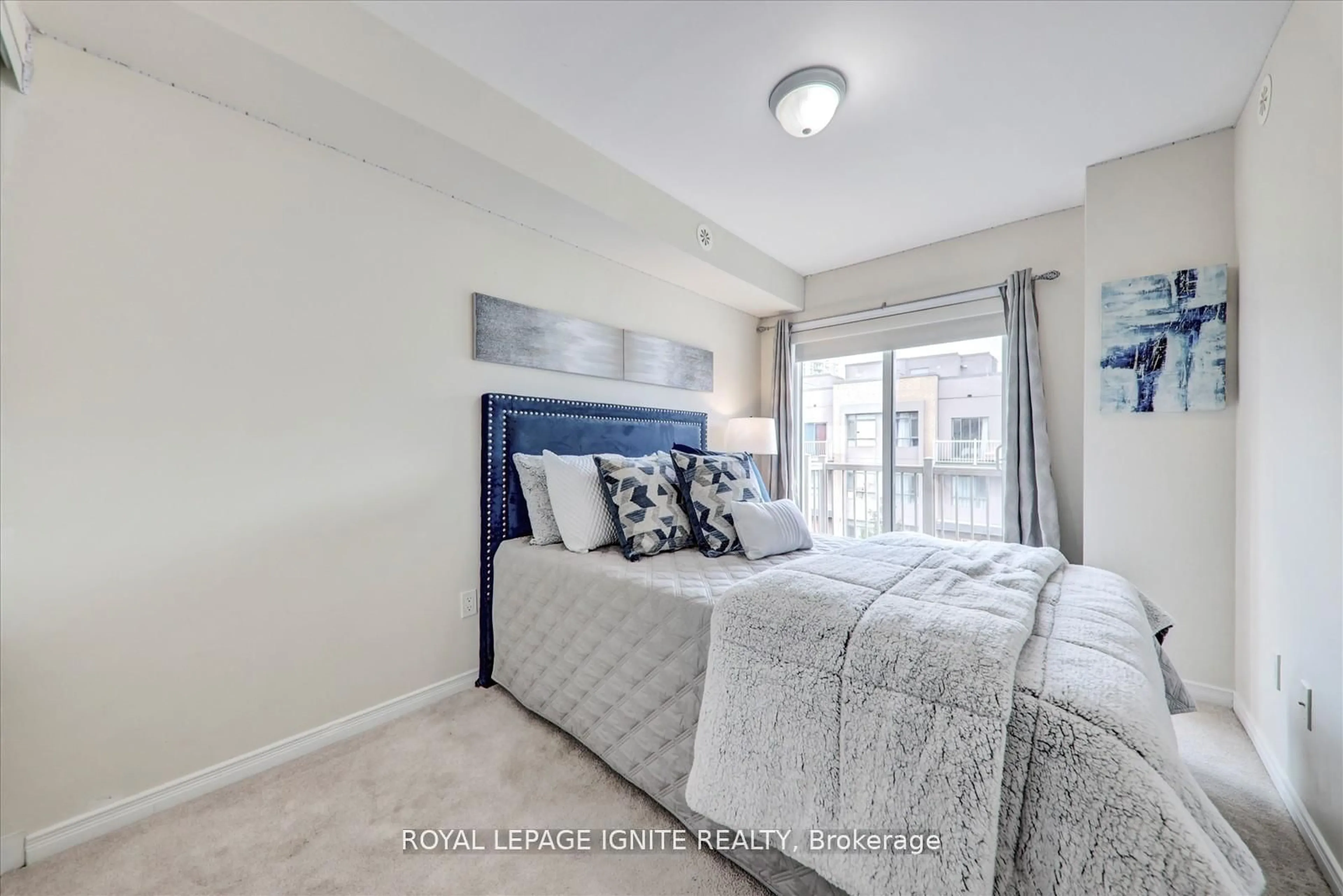 Bedroom with bed, carpet floor for 90 Orchid Place Dr #310, Toronto Ontario M1B 0C4