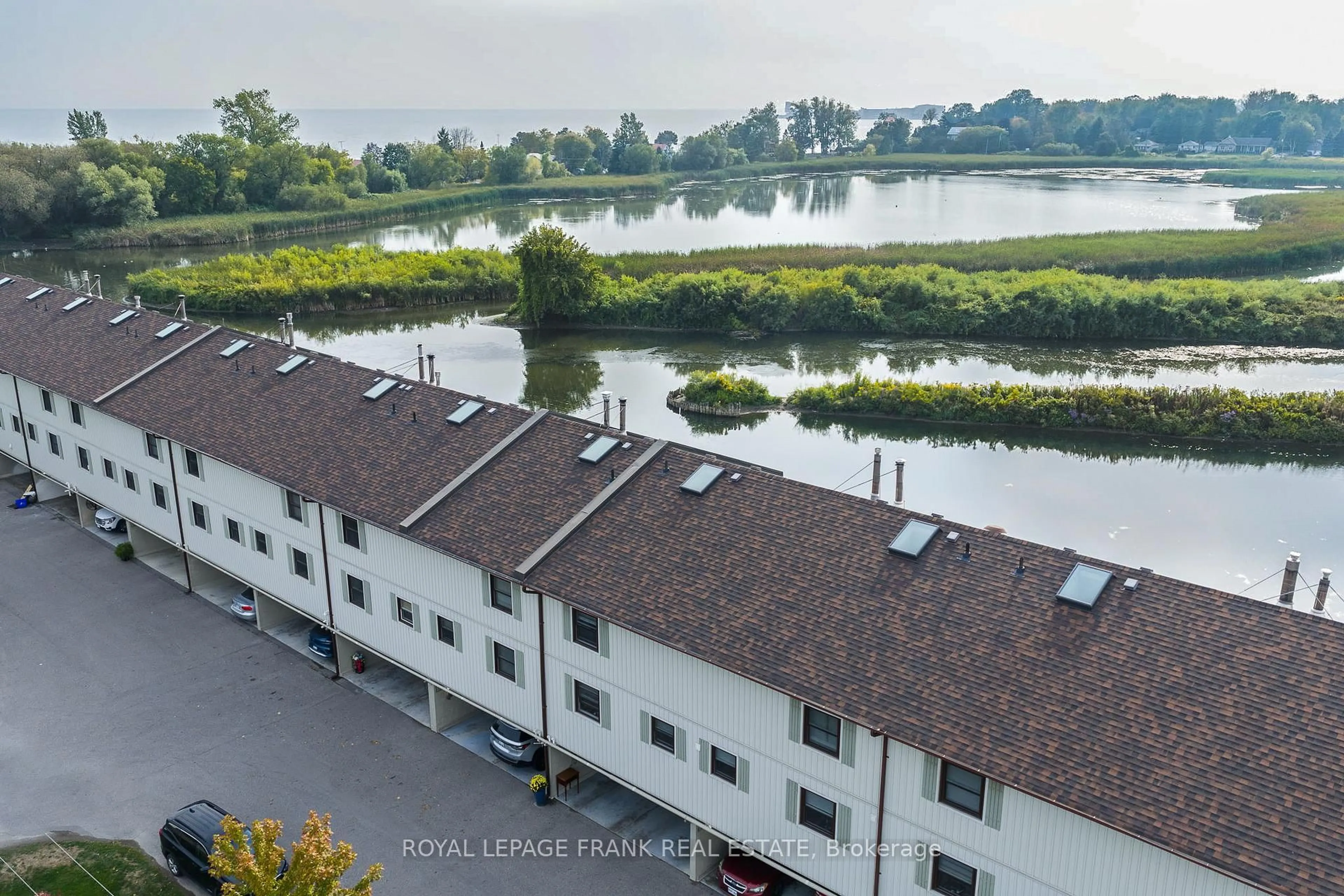 A pic from outside/outdoor area/front of a property/back of a property/a pic from drone, water/lake/river/ocean view for 120 Port Darlington Rd #15, Clarington Ontario L1C 3K3