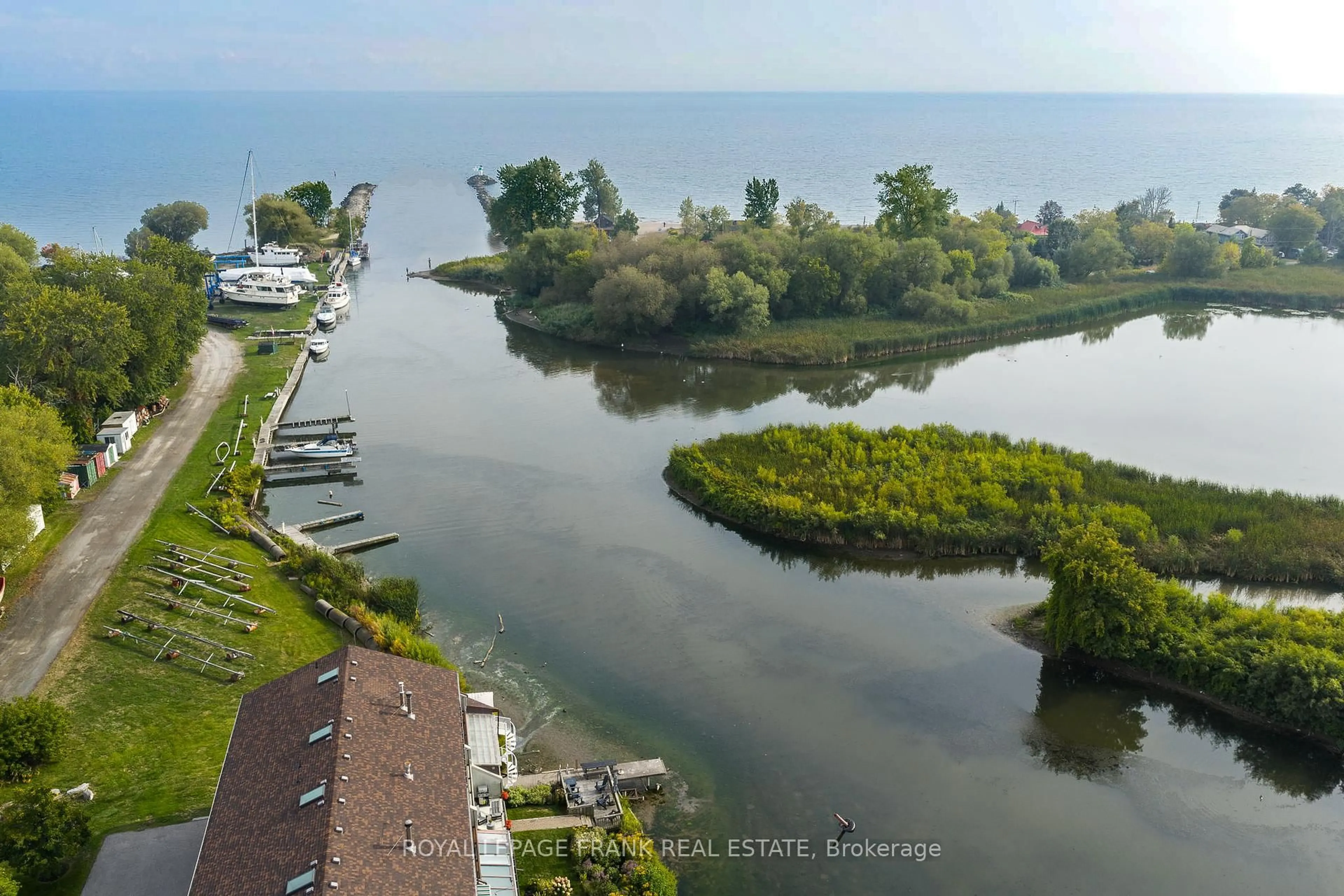 A pic from outside/outdoor area/front of a property/back of a property/a pic from drone, water/lake/river/ocean view for 120 Port Darlington Rd #15, Clarington Ontario L1C 3K3