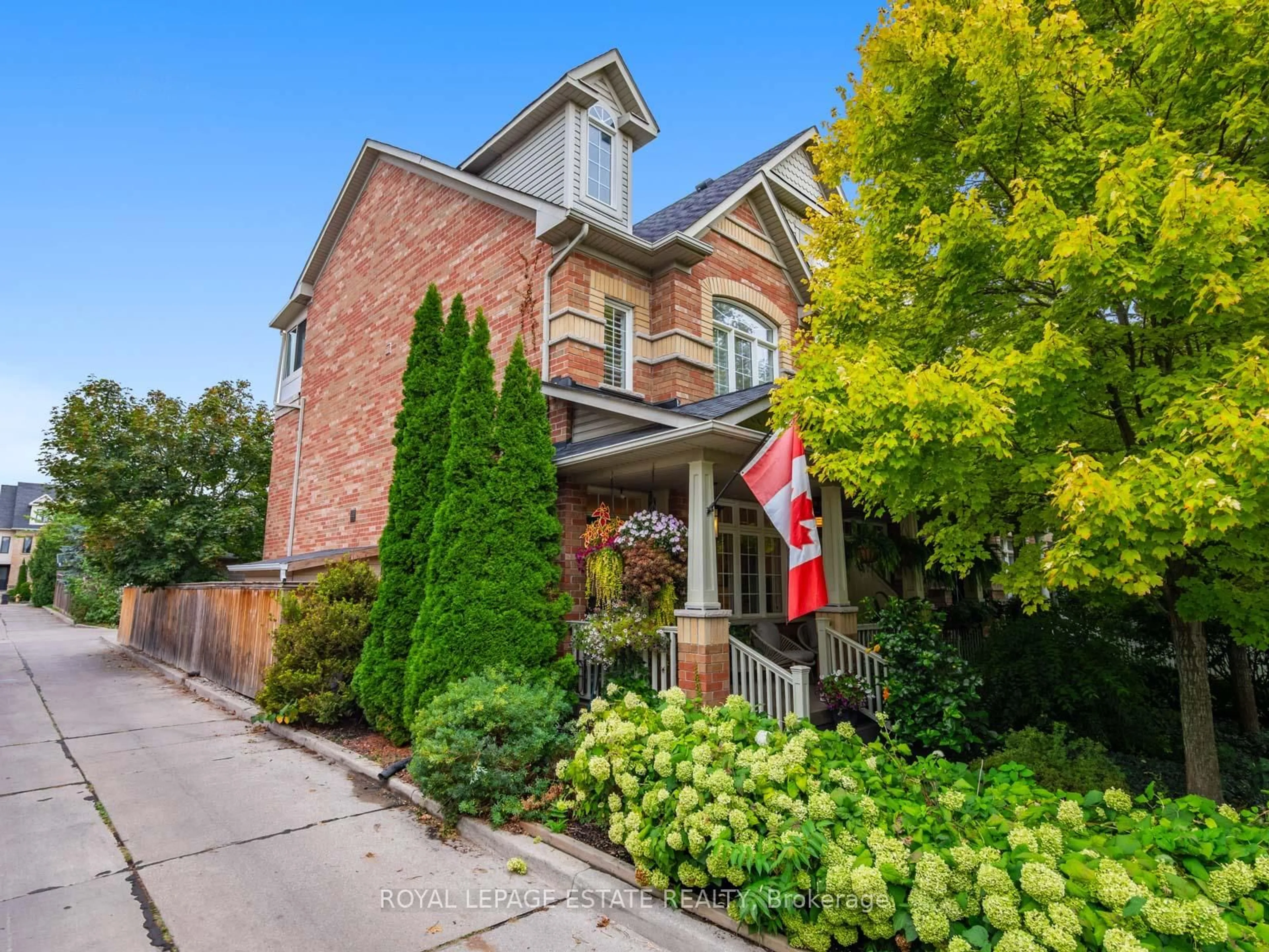 Home with brick exterior material, street for 18 Crossovers St, Toronto Ontario M4E 3X4