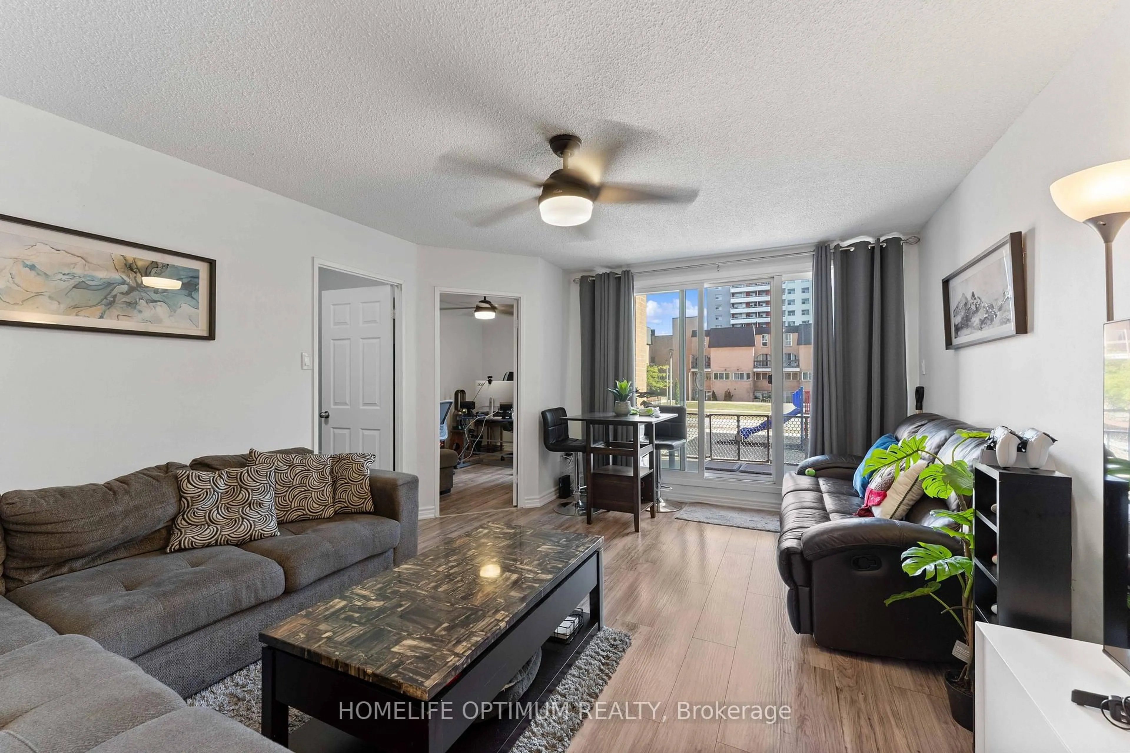 Living room with furniture, unknown for 100 Mornelle Crt #1076, Toronto Ontario M1E 4X2