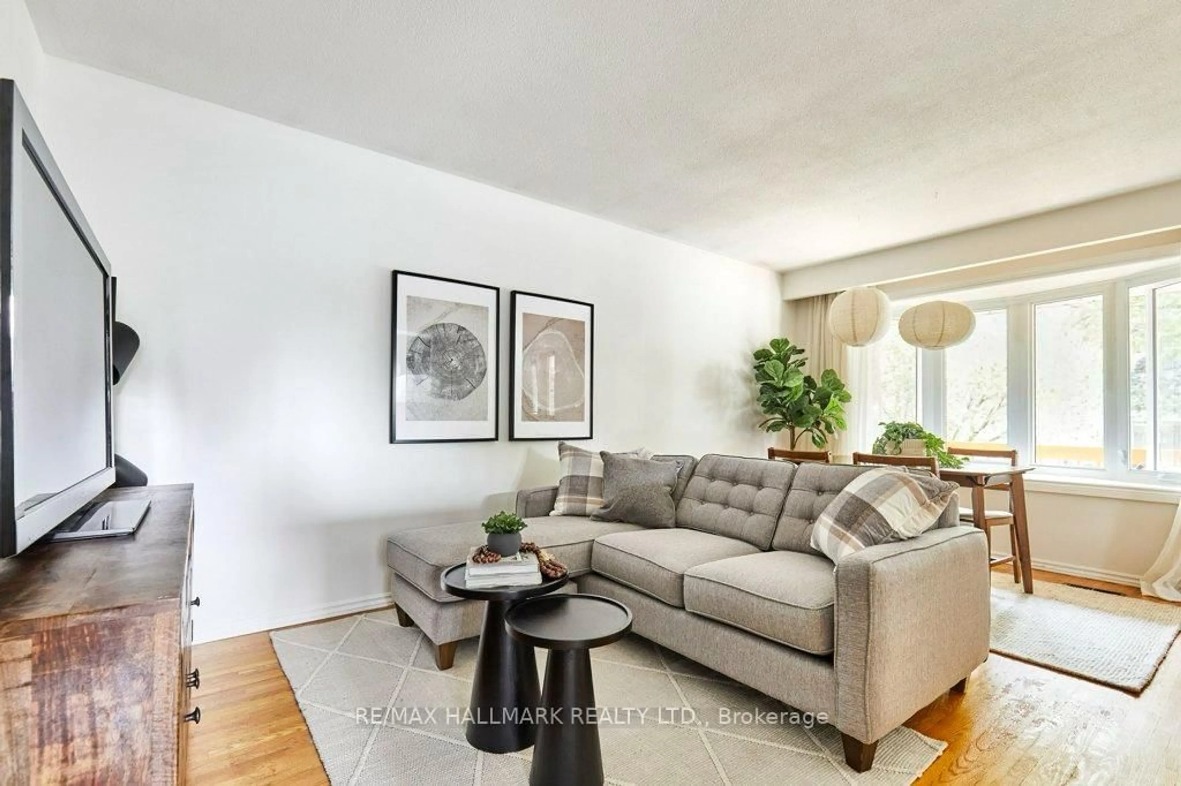 Living room with furniture, wood/laminate floor for 145 Clements Rd, Ajax Ontario L1S 1L9