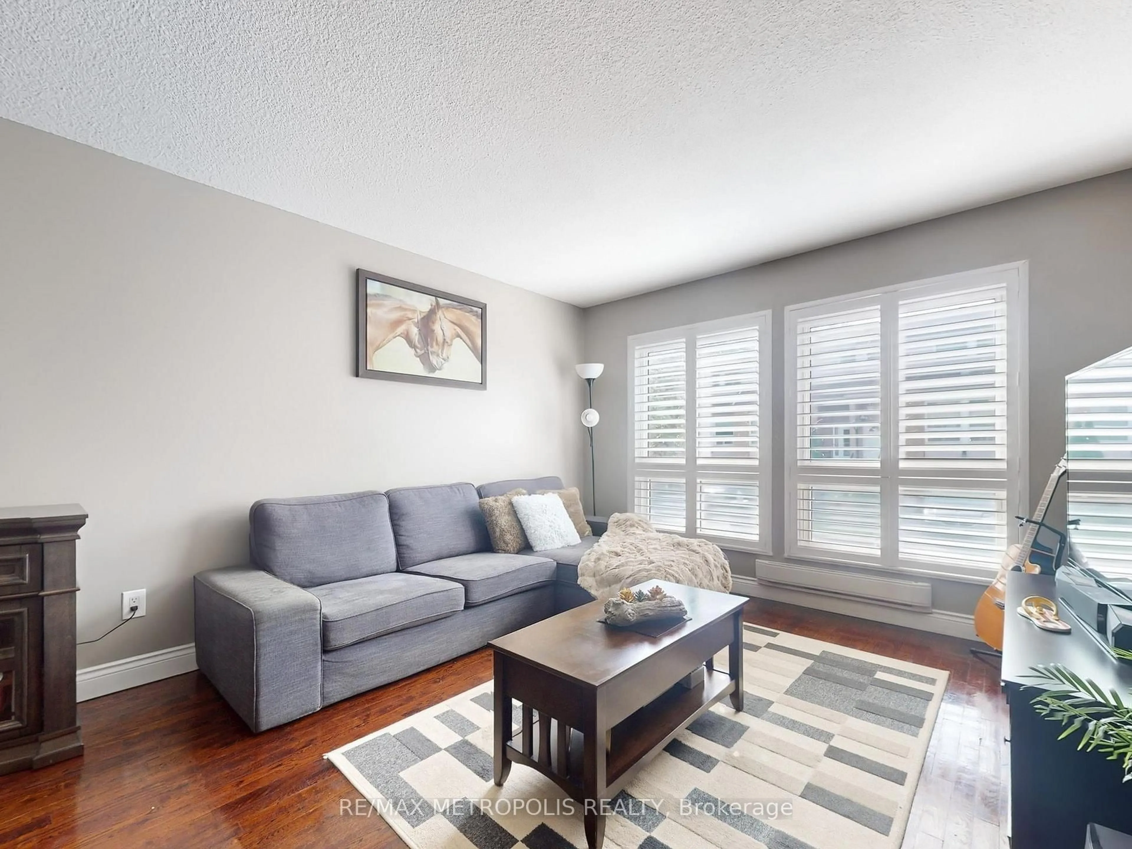 Living room with furniture, wood/laminate floor for 44 Willows Lane #4040, Ajax Ontario L1S 6E8