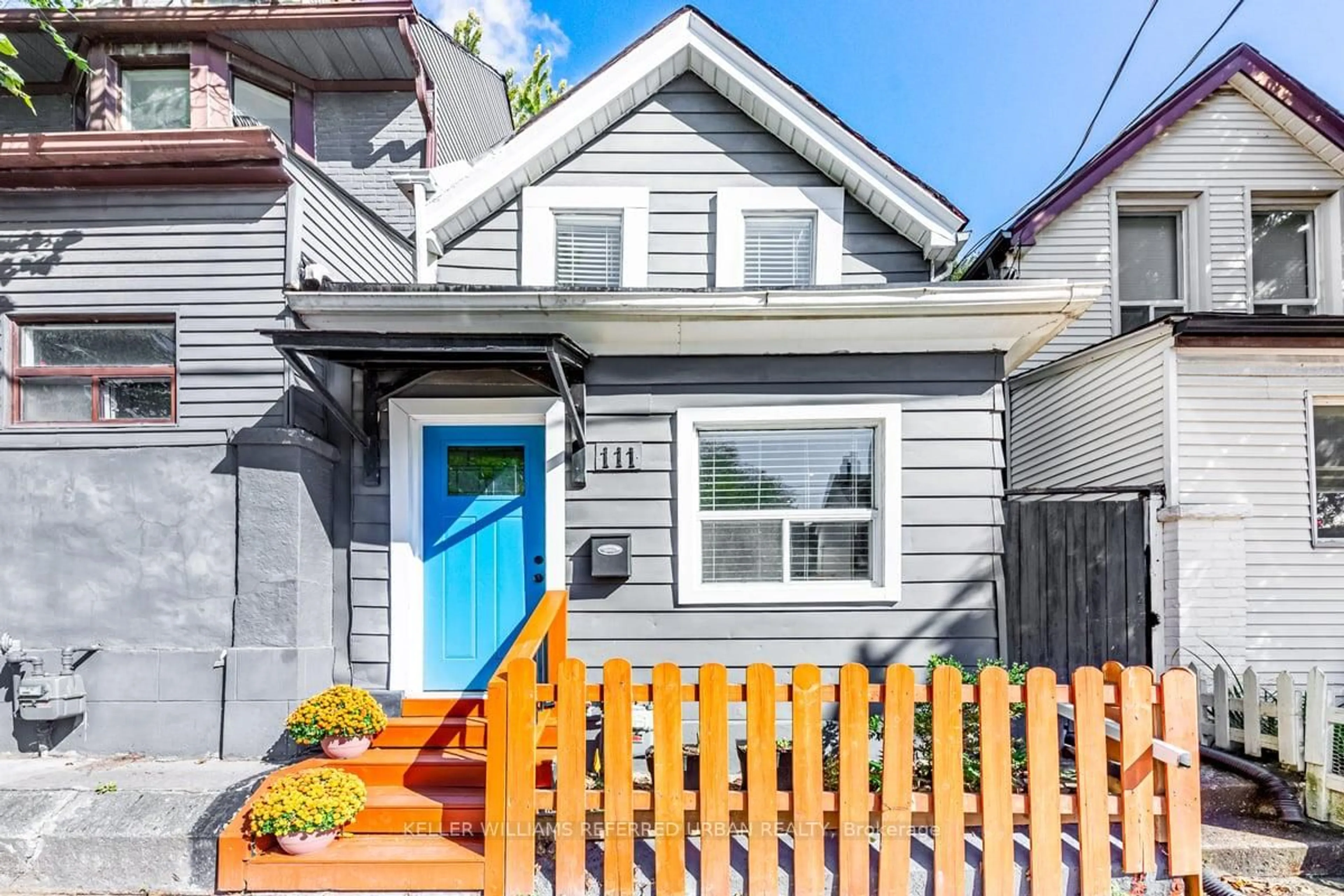 Home with vinyl exterior material, street for 111 Jones Ave, Toronto Ontario M4M 2Z7