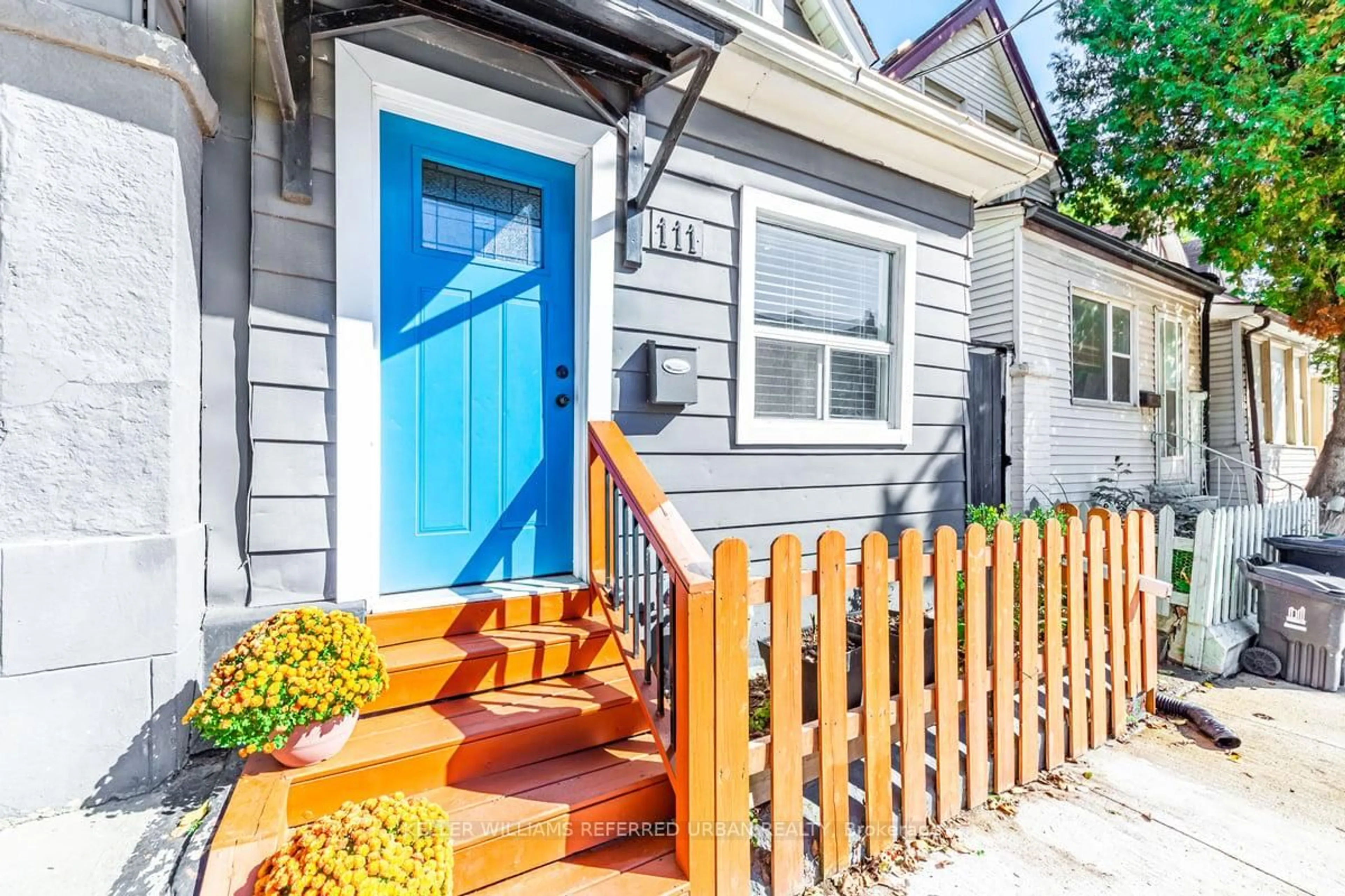 Home with vinyl exterior material, street for 111 Jones Ave, Toronto Ontario M4M 2Z7