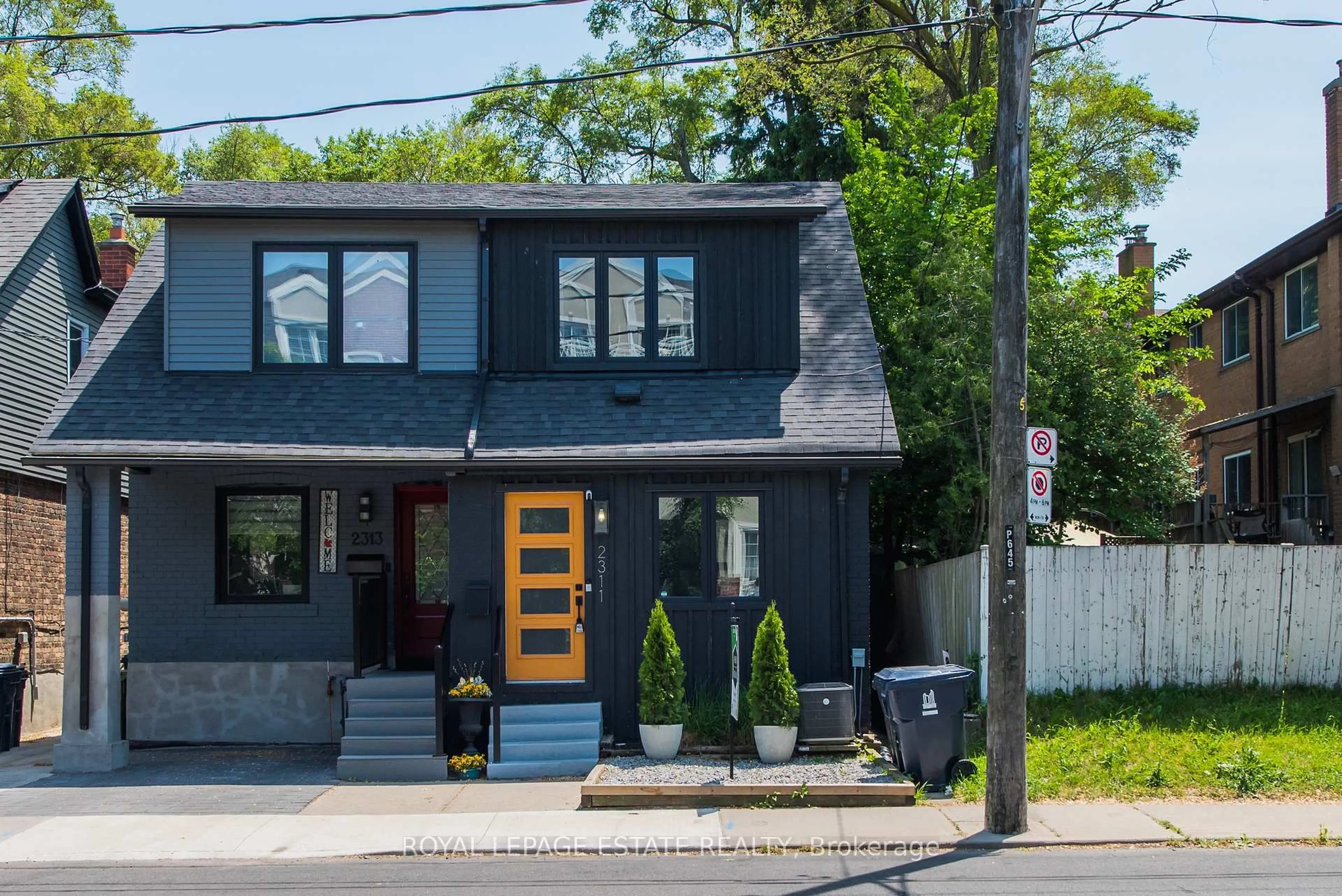Home with vinyl exterior material, street for 2311 Gerrard St, Toronto Ontario M4E 2E5