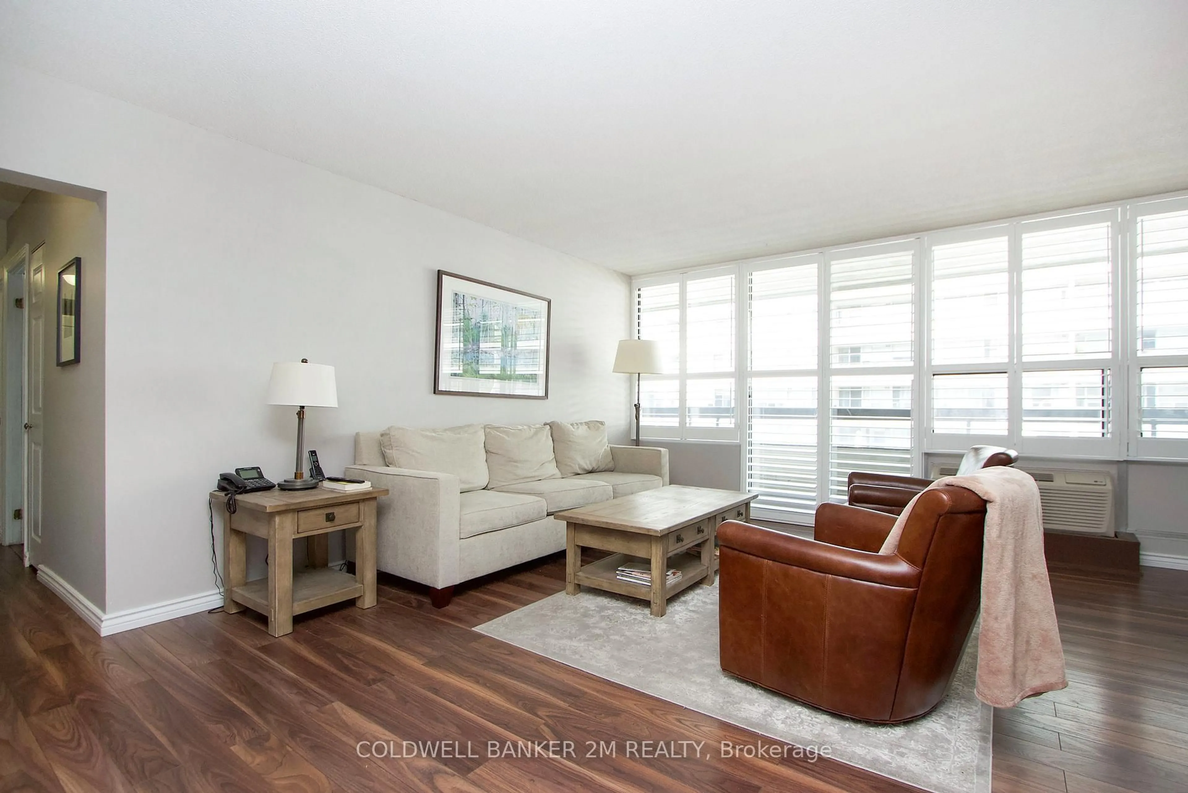 Living room with furniture, wood/laminate floor for 50 Richmond St #518, Oshawa Ontario L1G 7C7