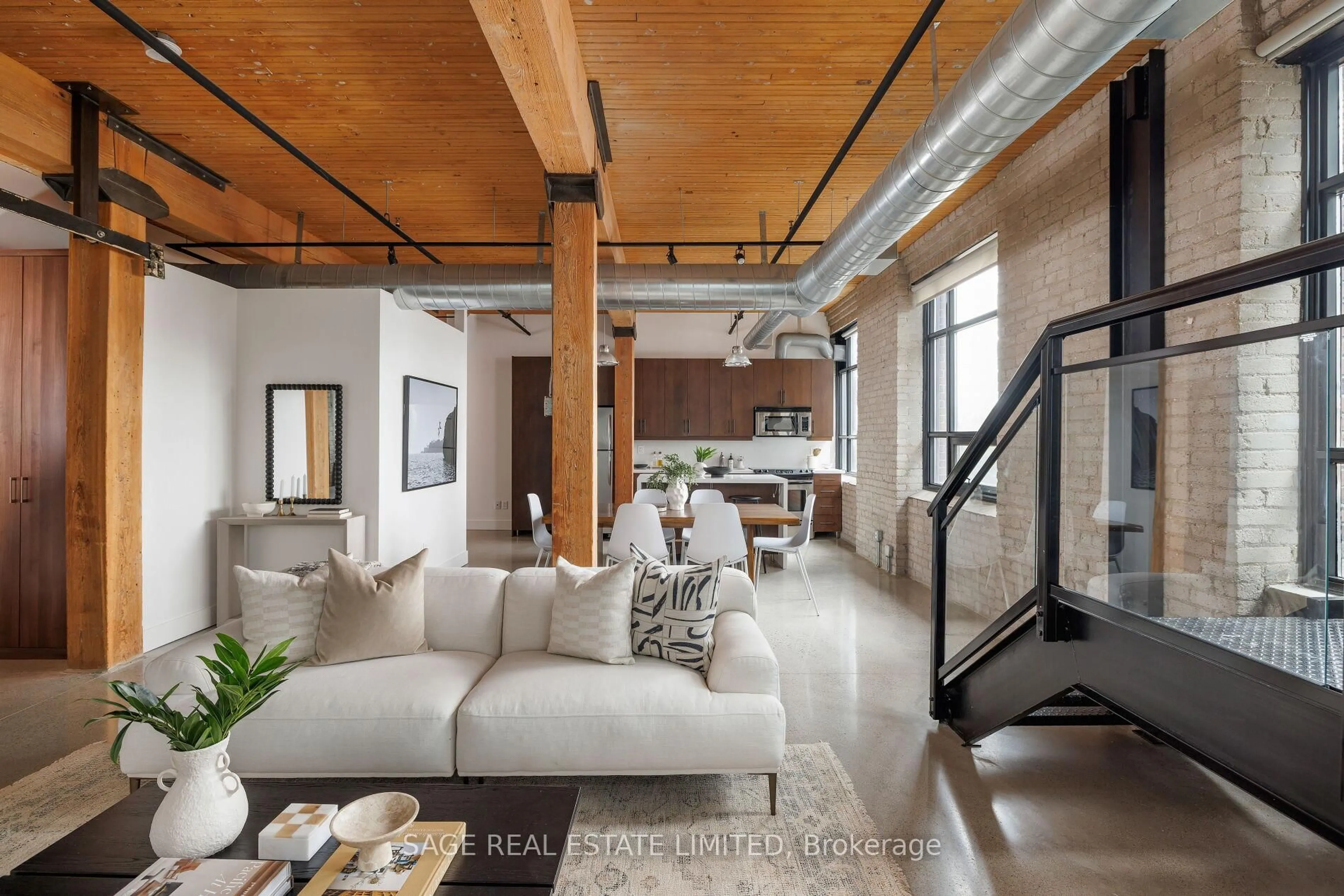 Living room with furniture, cement floor for 68 Broadview Ave #308, Toronto Ontario M4M 2E6