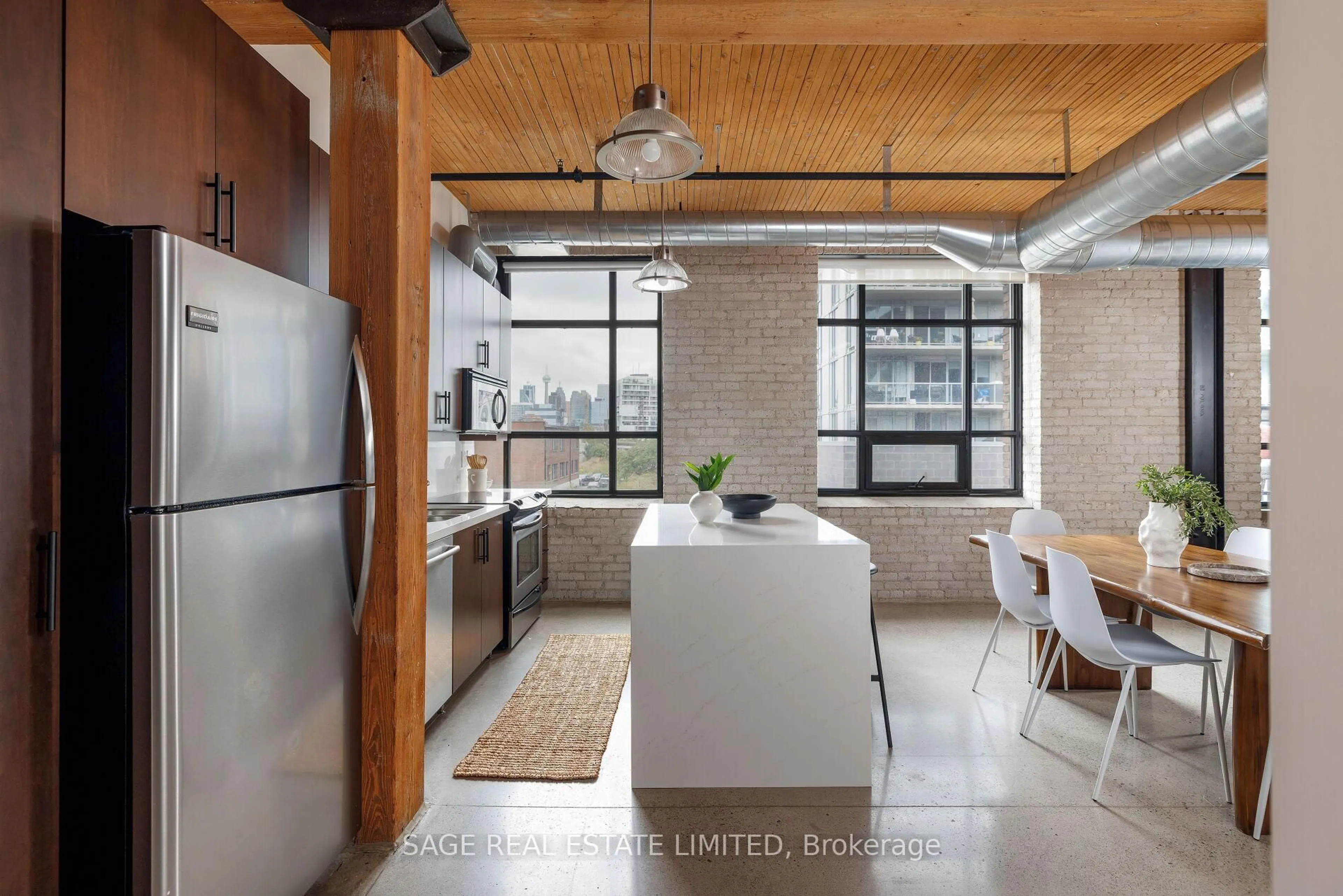 Open concept kitchen, cement floor for 68 Broadview Ave #308, Toronto Ontario M4M 2E6