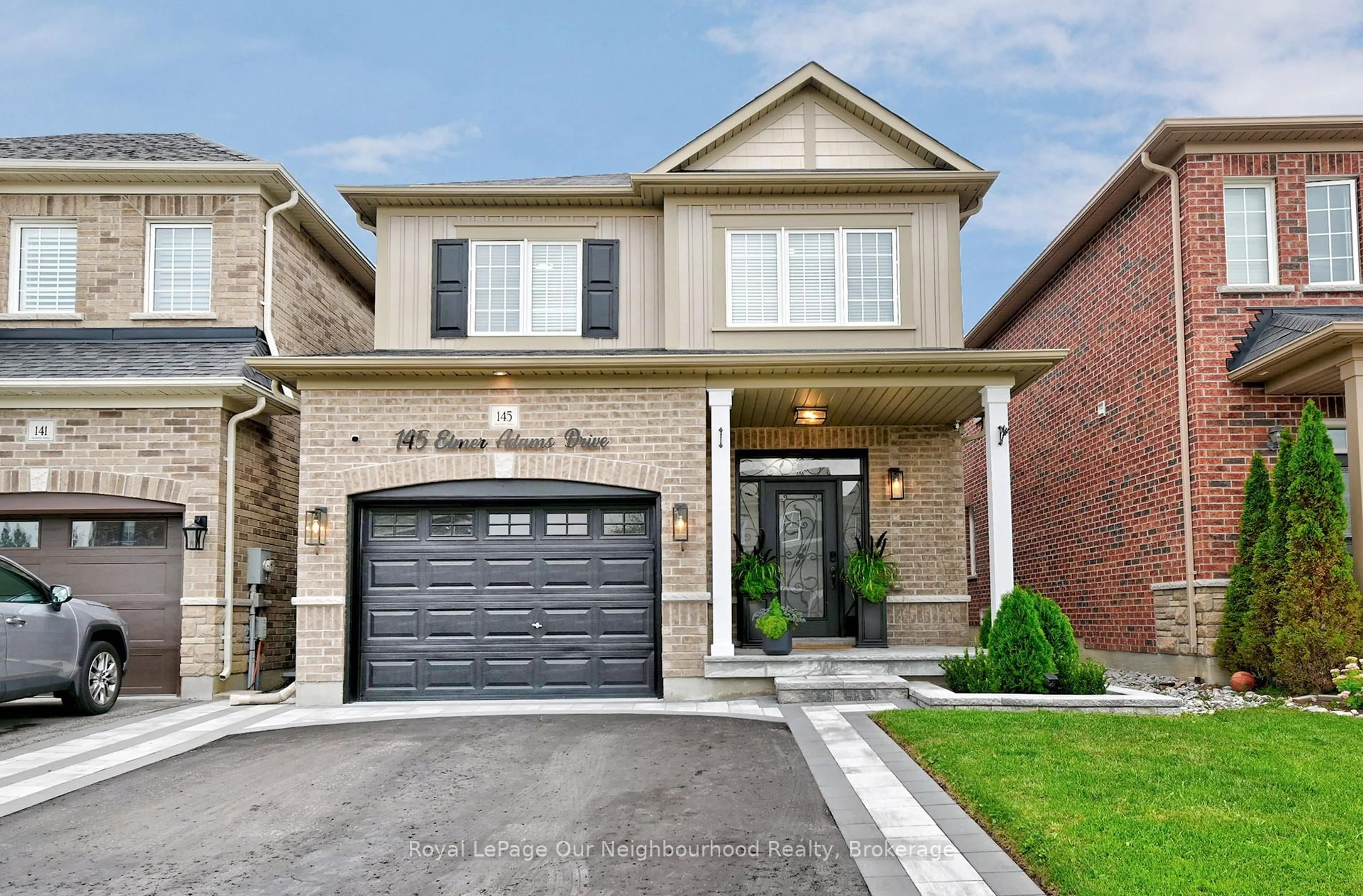 Home with brick exterior material, street for 145 Elmer Adams Dr, Clarington Ontario L1E 0G4