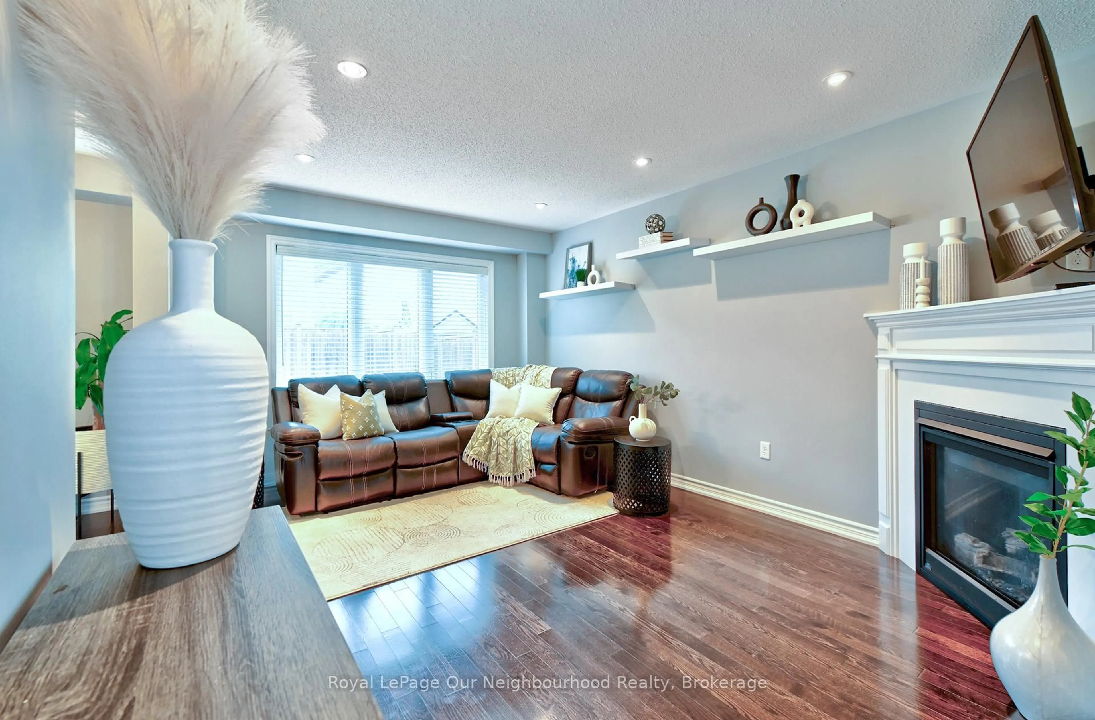 Living room with furniture, wood/laminate floor for 145 Elmer Adams Dr, Clarington Ontario L1E 0G4