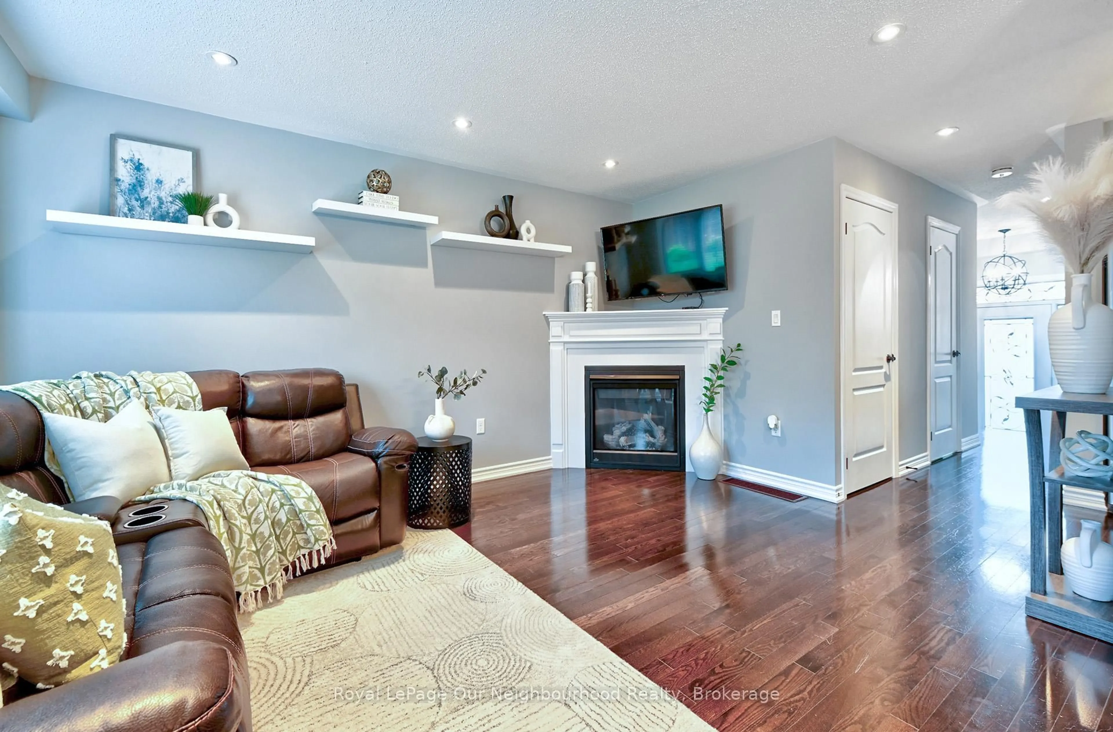 Living room with furniture, wood/laminate floor for 145 Elmer Adams Dr, Clarington Ontario L1E 0G4