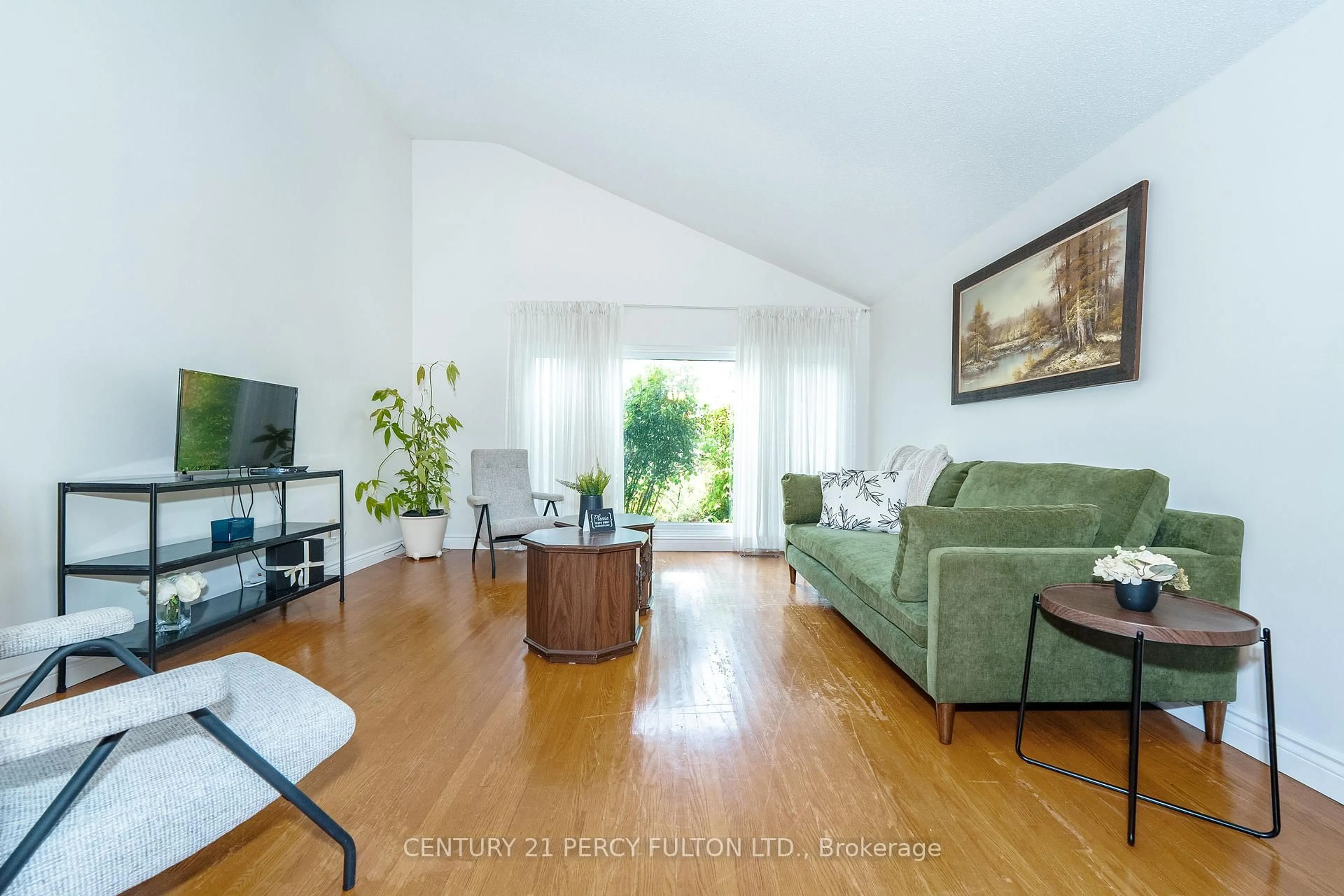 Living room with furniture, wood/laminate floor for 67 Orton Park Rd, Toronto Ontario M1G 3G7