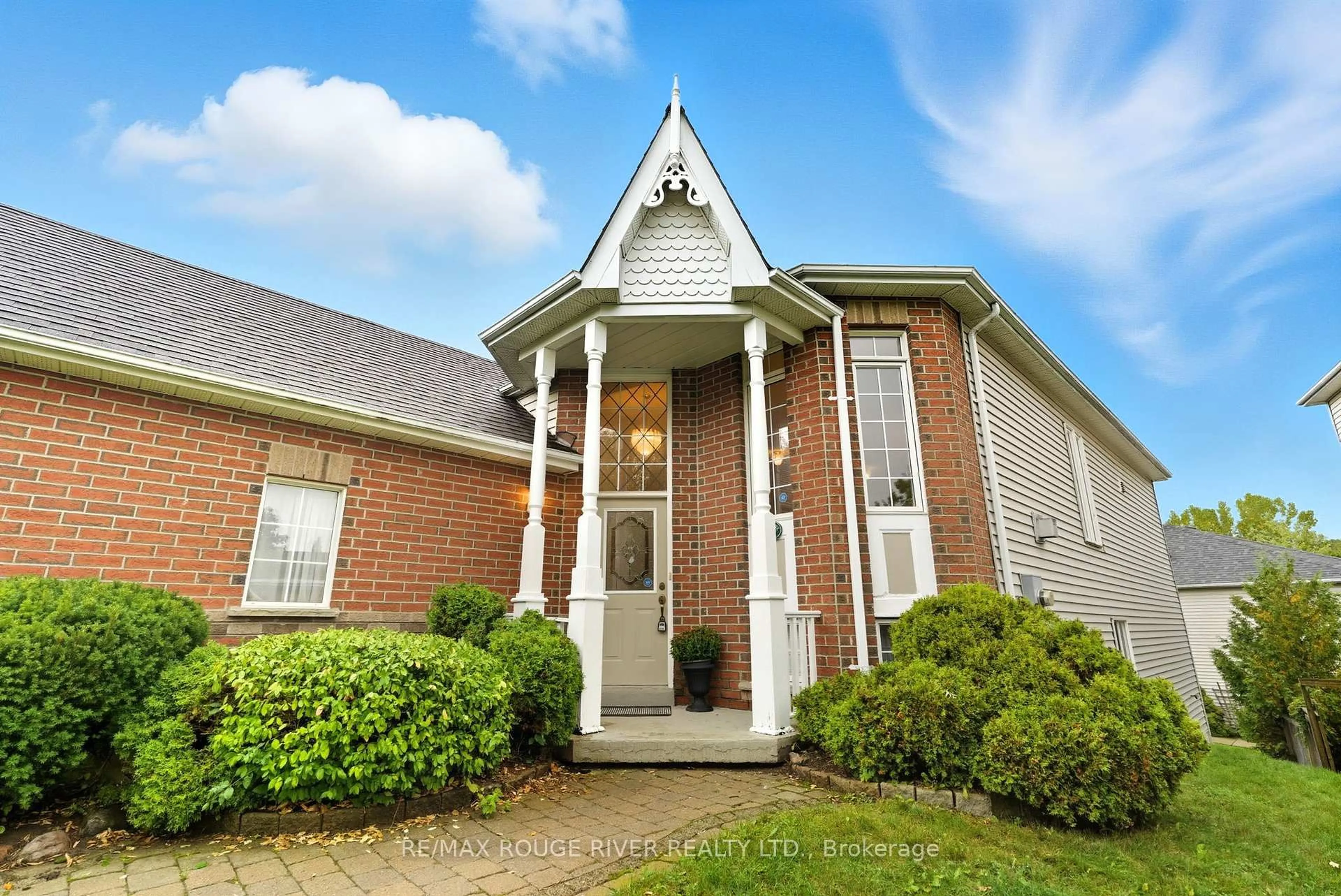 Home with brick exterior material, street for 1050 Ridgemount Blvd, Oshawa Ontario L1K 2K7