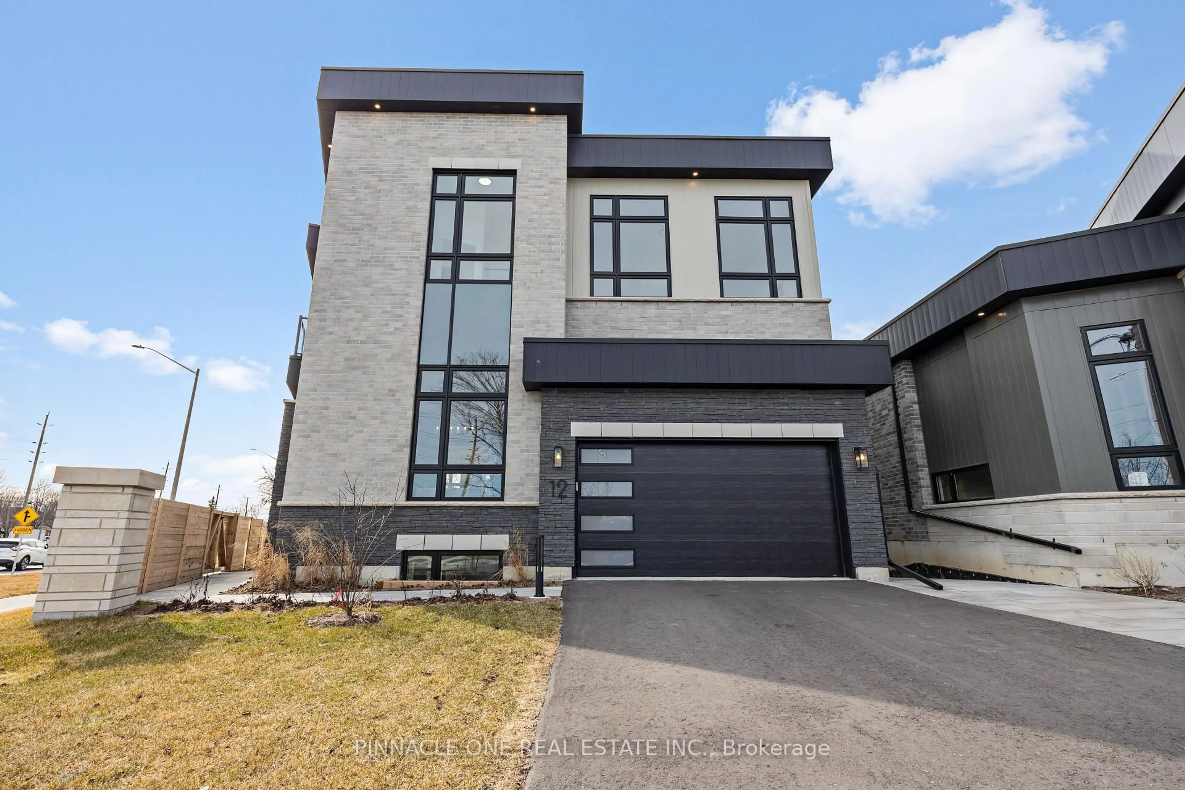 Home with brick exterior material, street for 12 Tidmarsh Lane, Ajax Ontario L1T 4S1