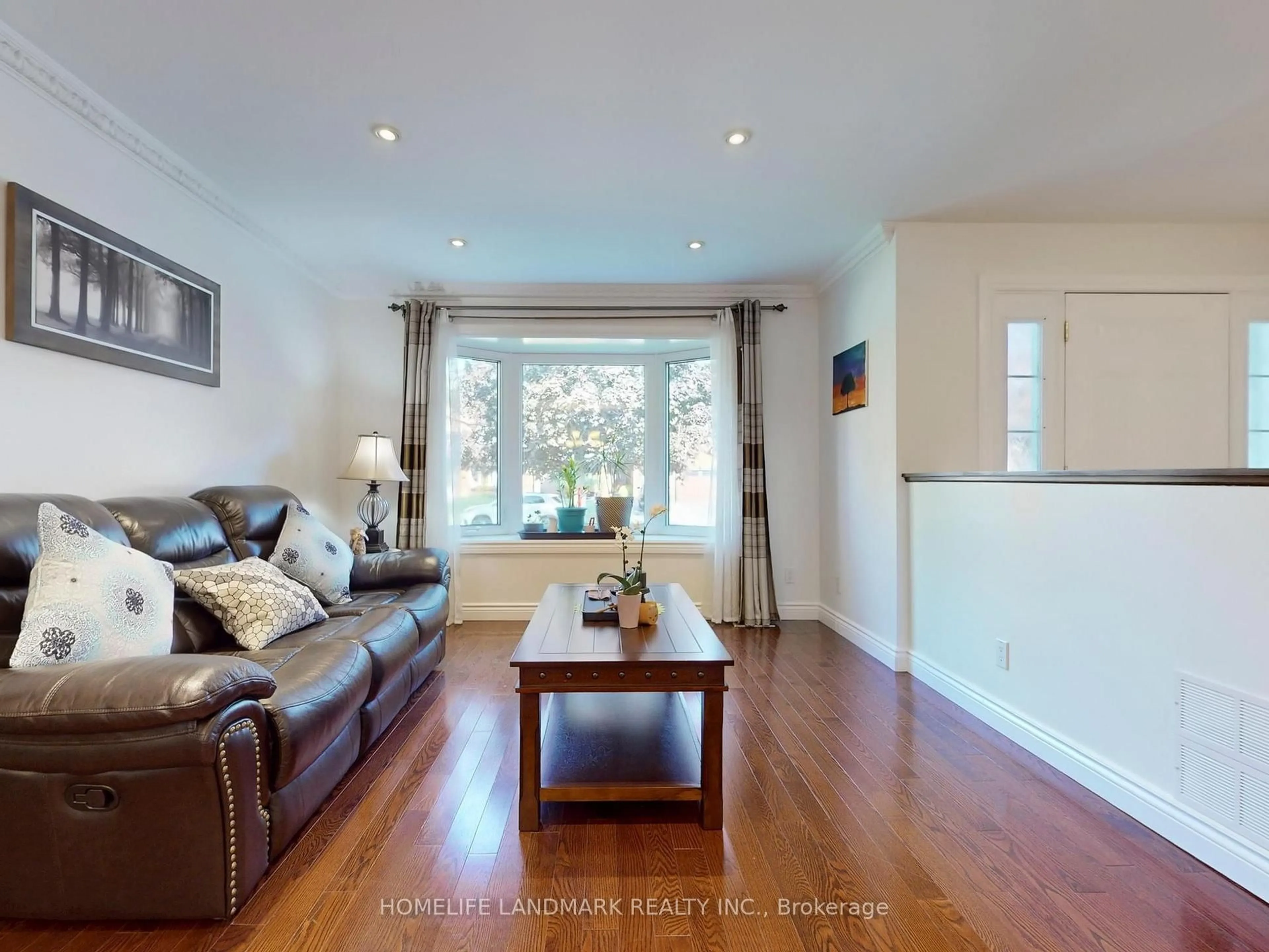 Living room with furniture, wood/laminate floor for 6 Broughton Crt, Whitby Ontario L1N 6Y8