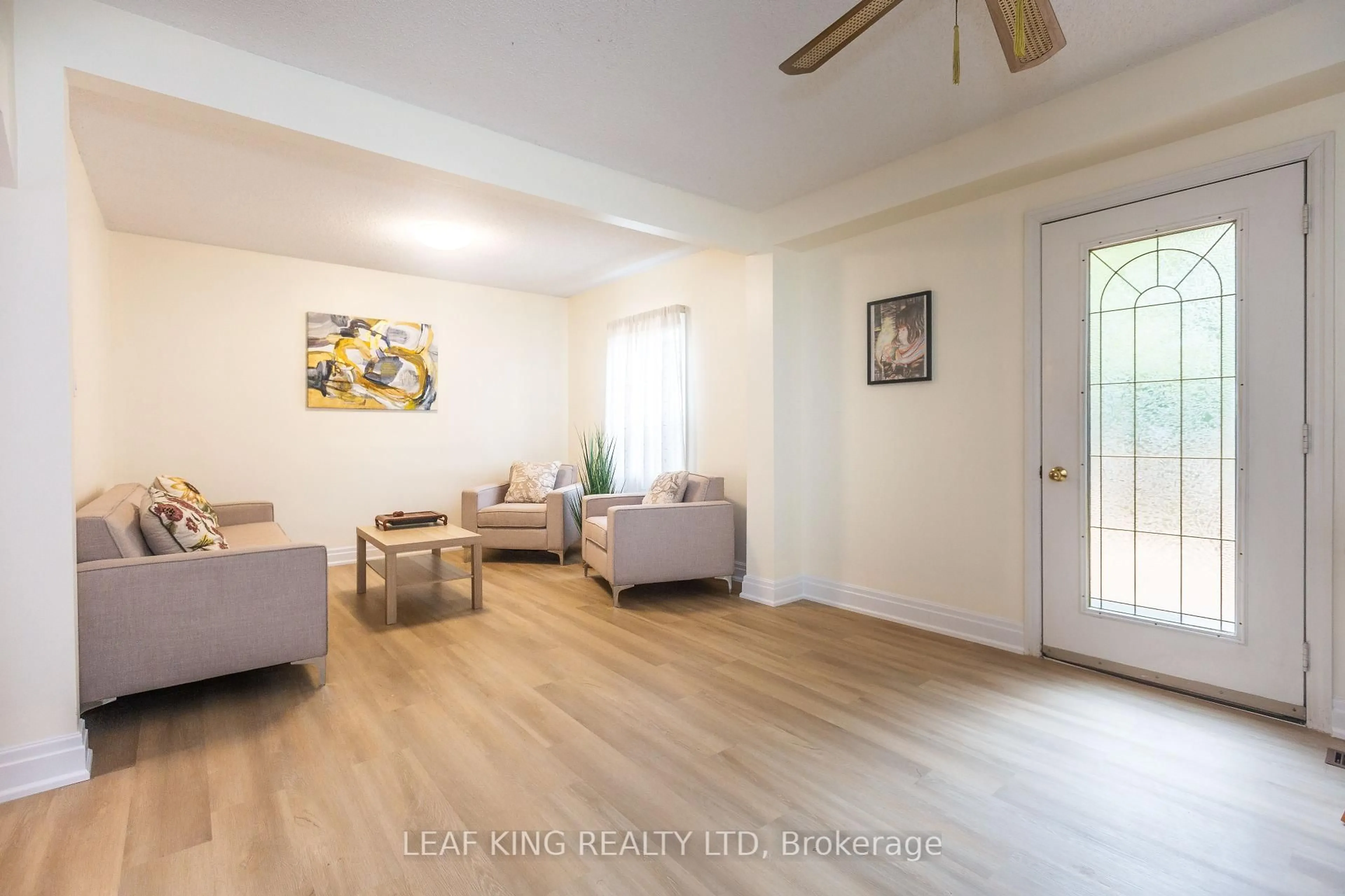 Living room with furniture, wood/laminate floor for 8 Southmead Rd, Toronto Ontario M1L 2H8