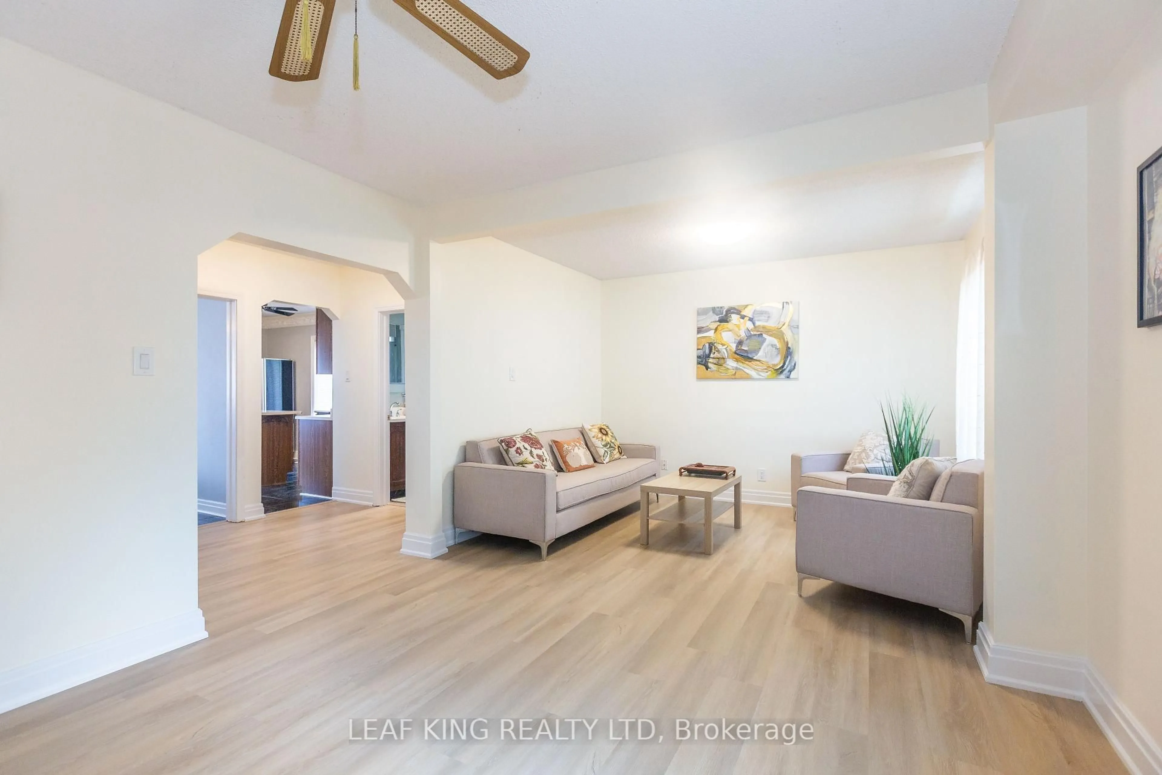 Living room with furniture, wood/laminate floor for 8 Southmead Rd, Toronto Ontario M1L 2H8