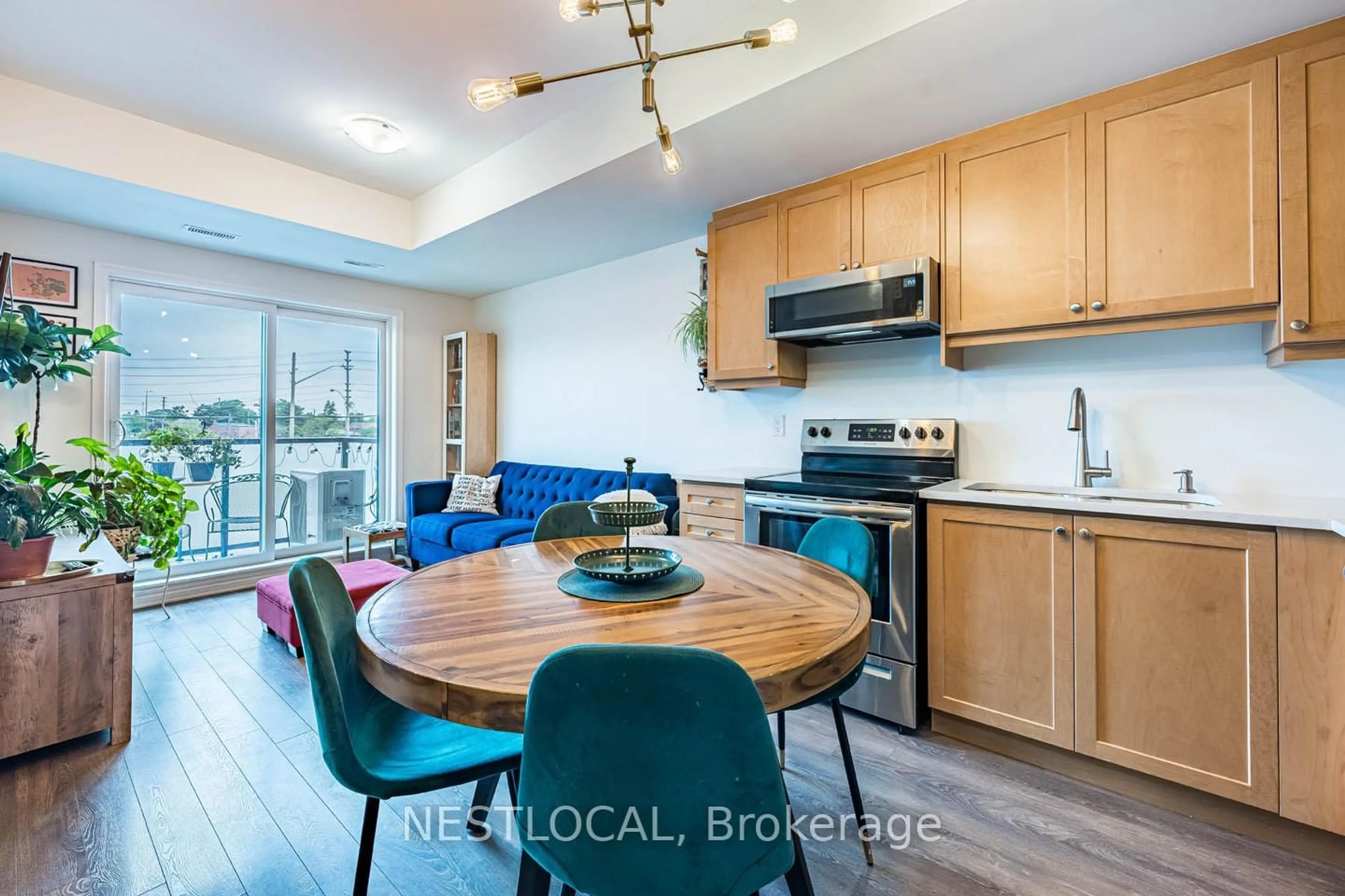 Open concept kitchen, wood/laminate floor for 1085 Danforth Rd #206, Toronto Ontario M1J 0B2