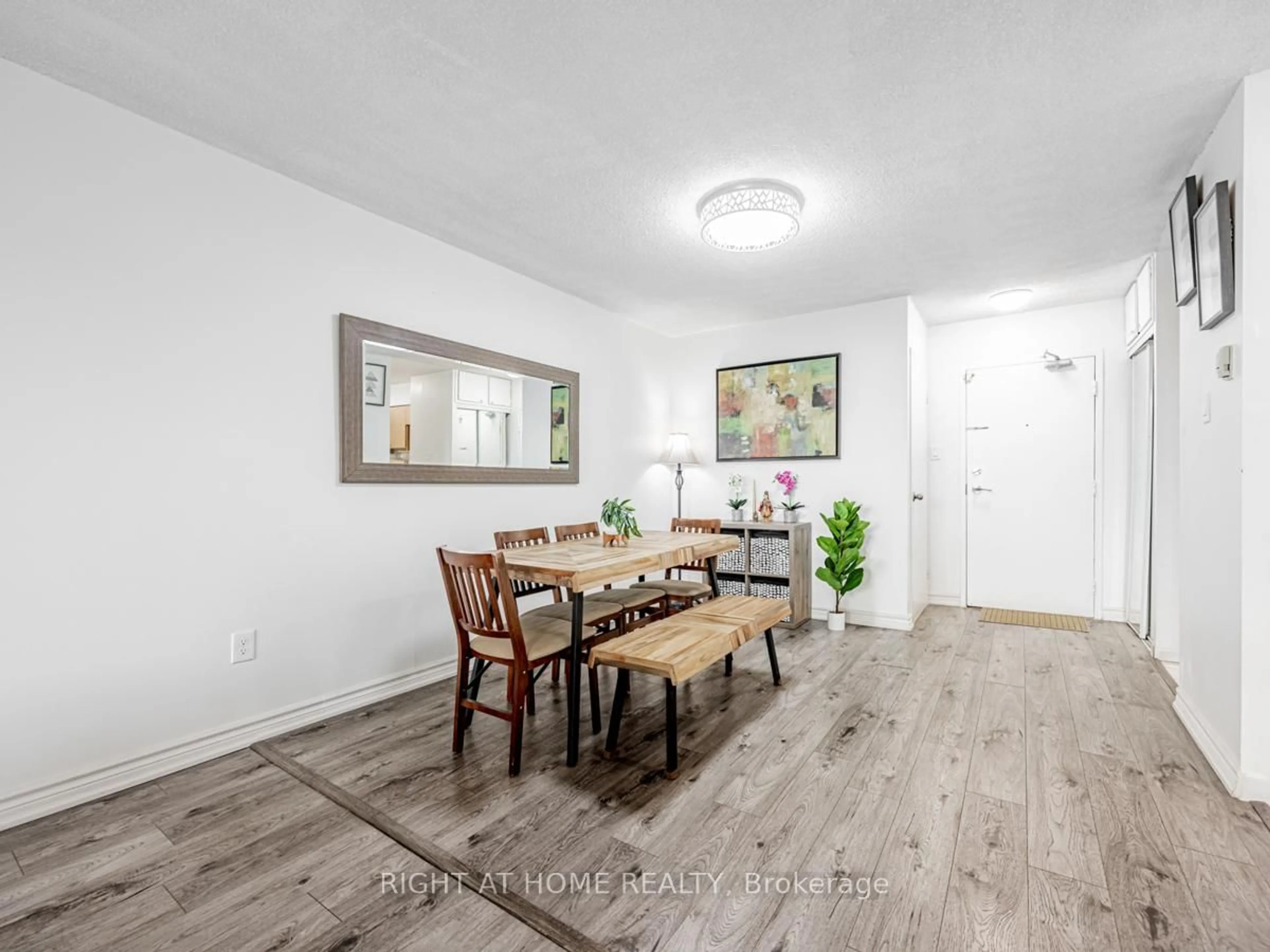 Dining room, wood/laminate floor for 2050 Bridletowne Circ #911, Toronto Ontario M1W 2V5