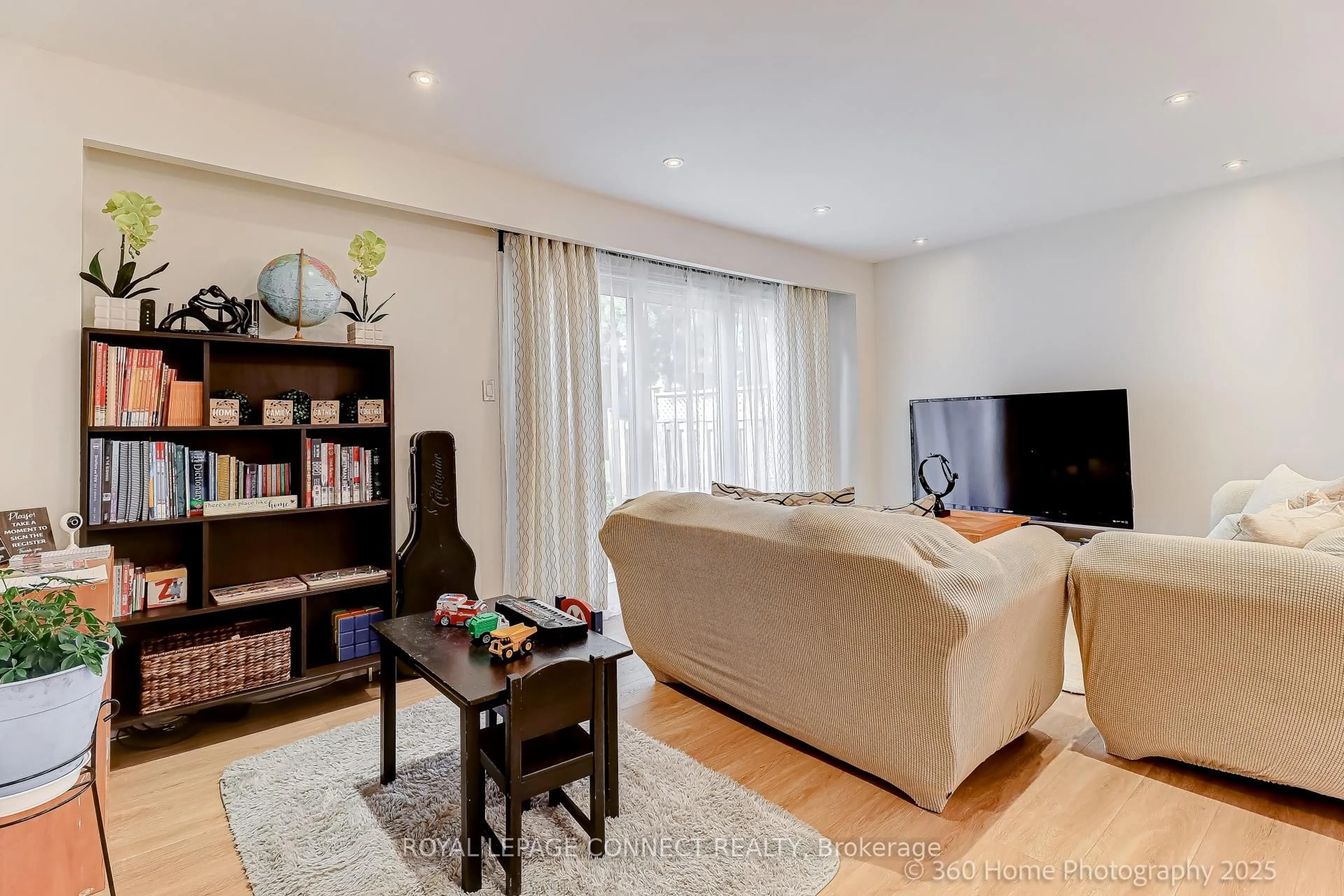 Living room with furniture, wood/laminate floor for 441 Military Tr #70, Toronto Ontario M1E 4E8
