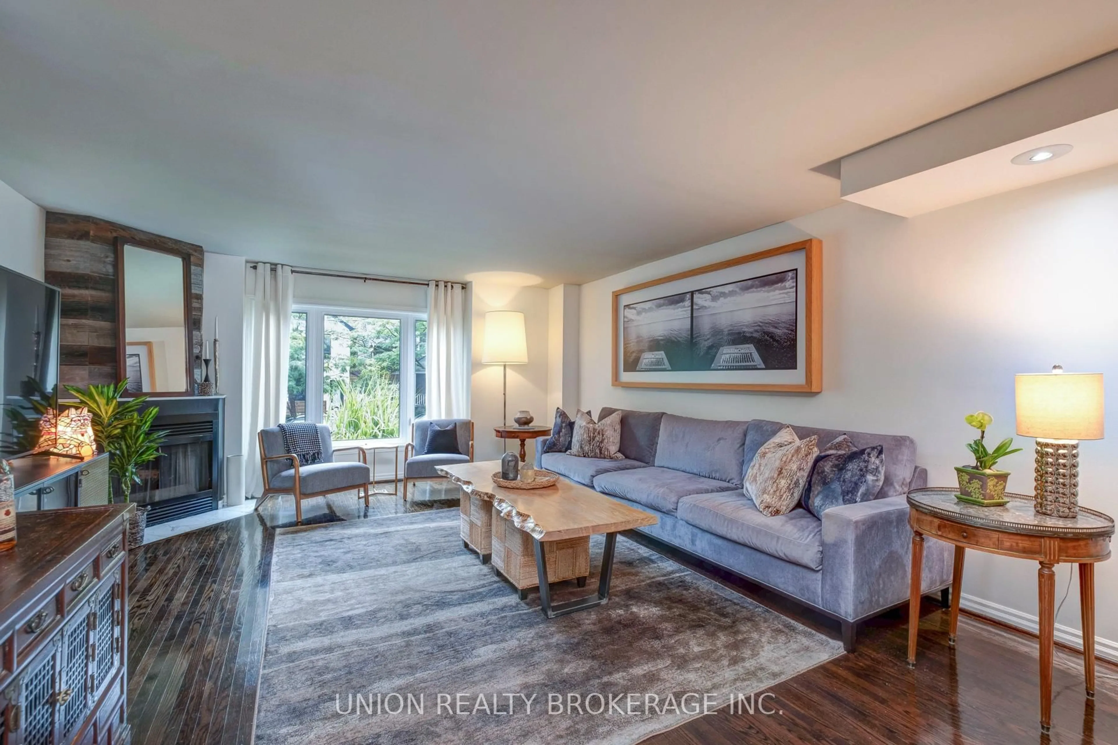 Living room with furniture, wood/laminate floor for 46 Hunter St, Toronto Ontario M4J 1C2