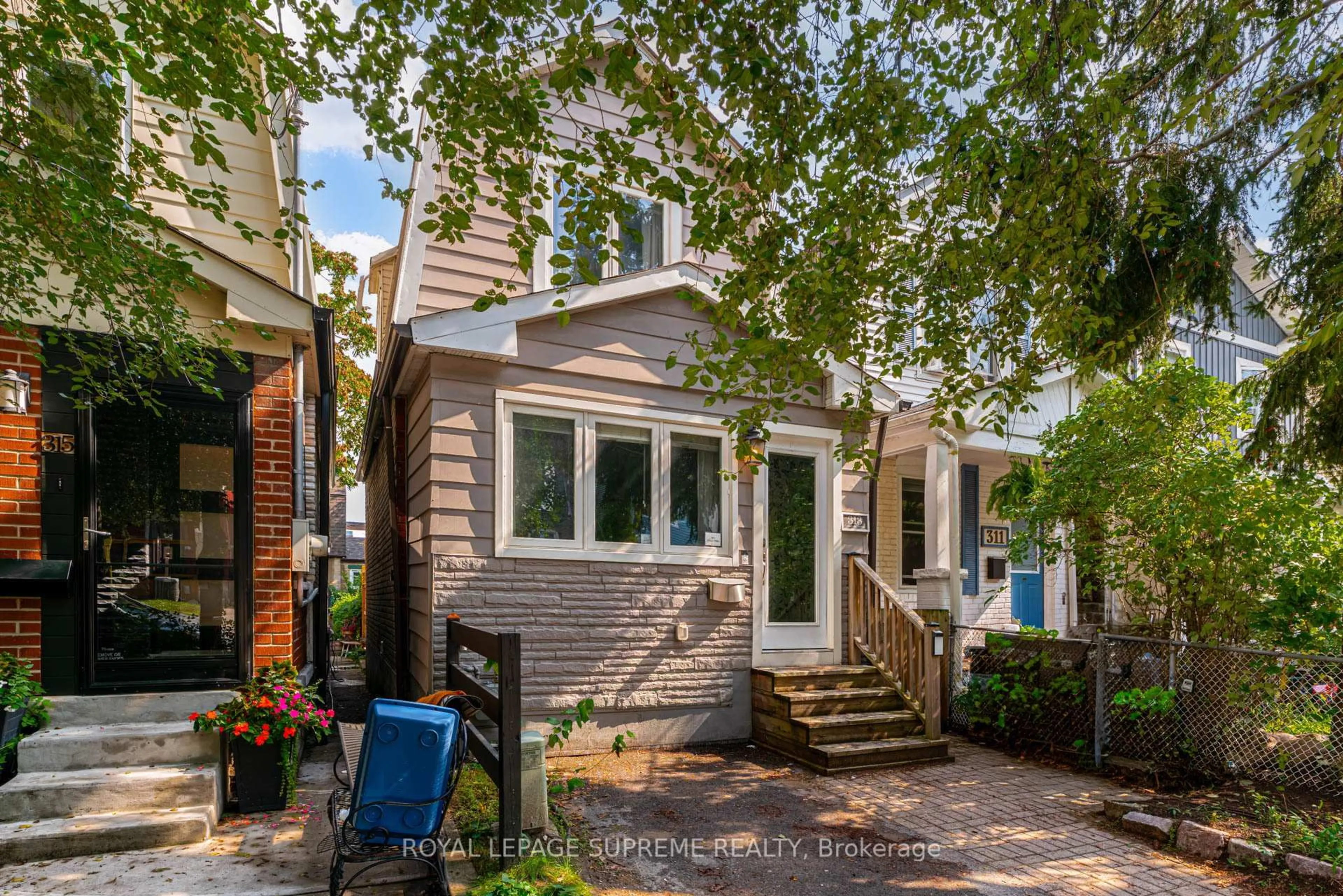 Home with brick exterior material, street for 313 Cedarvale Ave, Toronto Ontario M4C 4K3