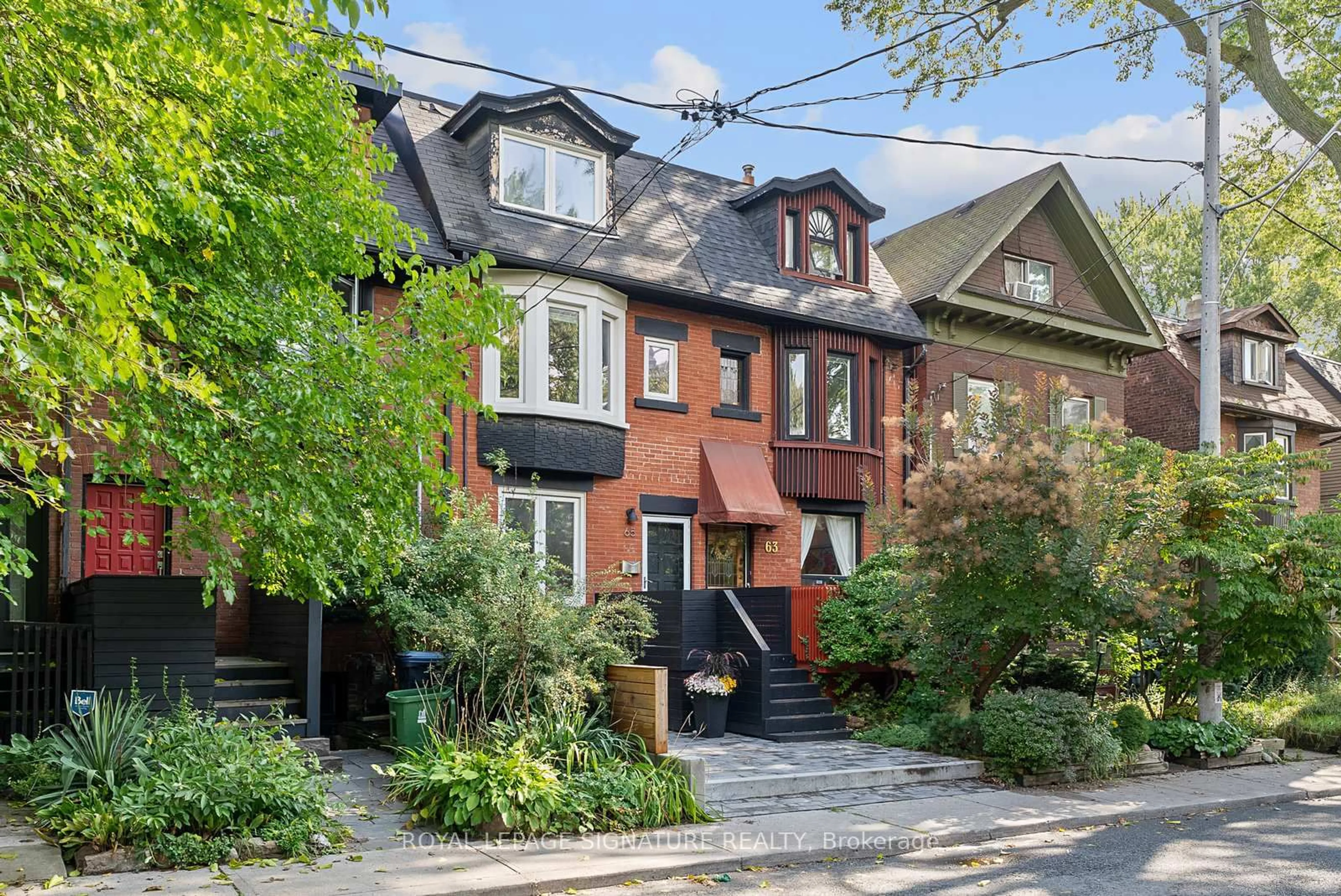 Home with brick exterior material, street for 65 West Ave, Toronto Ontario M4M 2L7