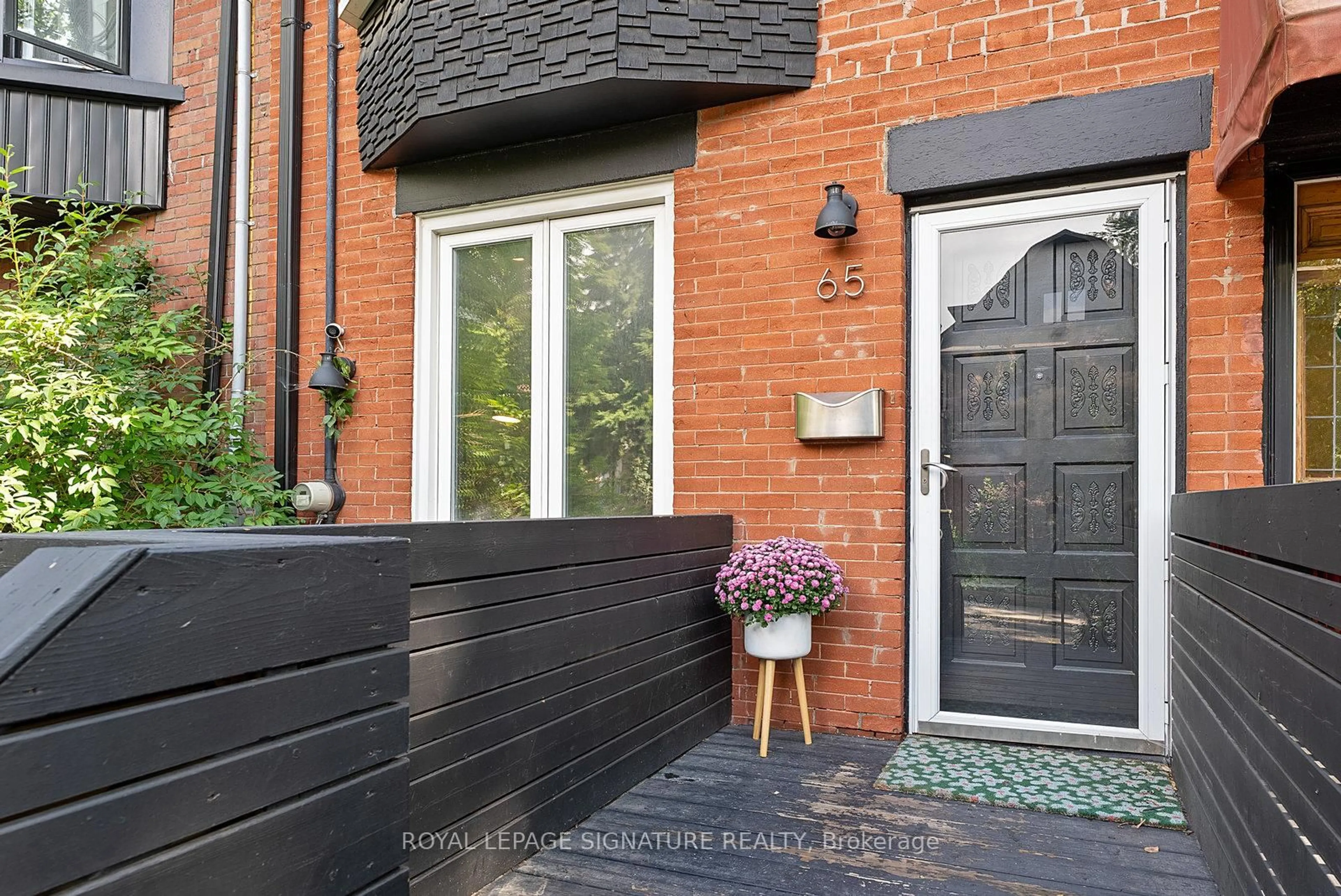 Home with brick exterior material, street for 65 West Ave, Toronto Ontario M4M 2L7