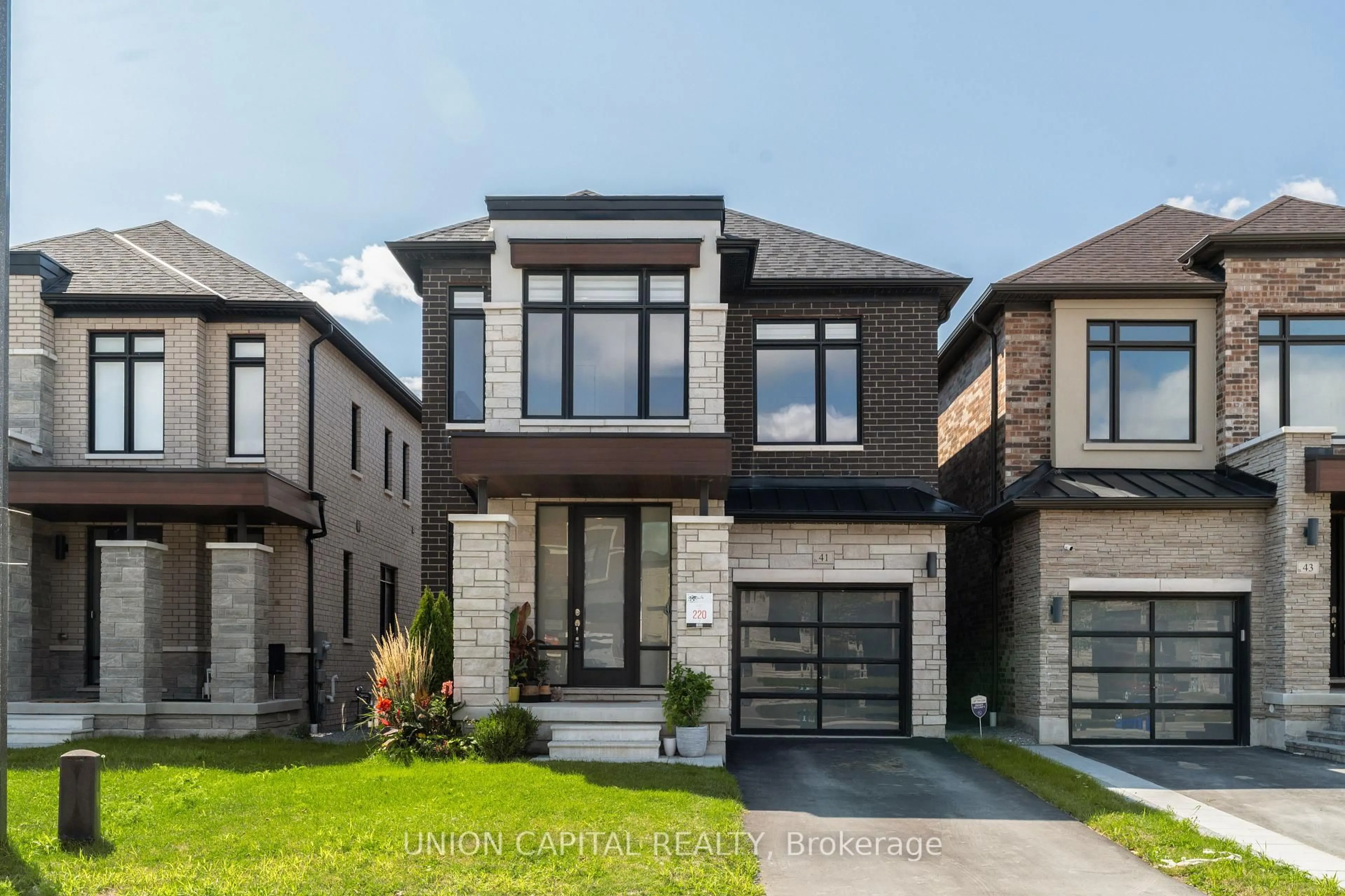 Home with brick exterior material, street for 41 Auckland Dr, Whitby Ontario L1P 0H4