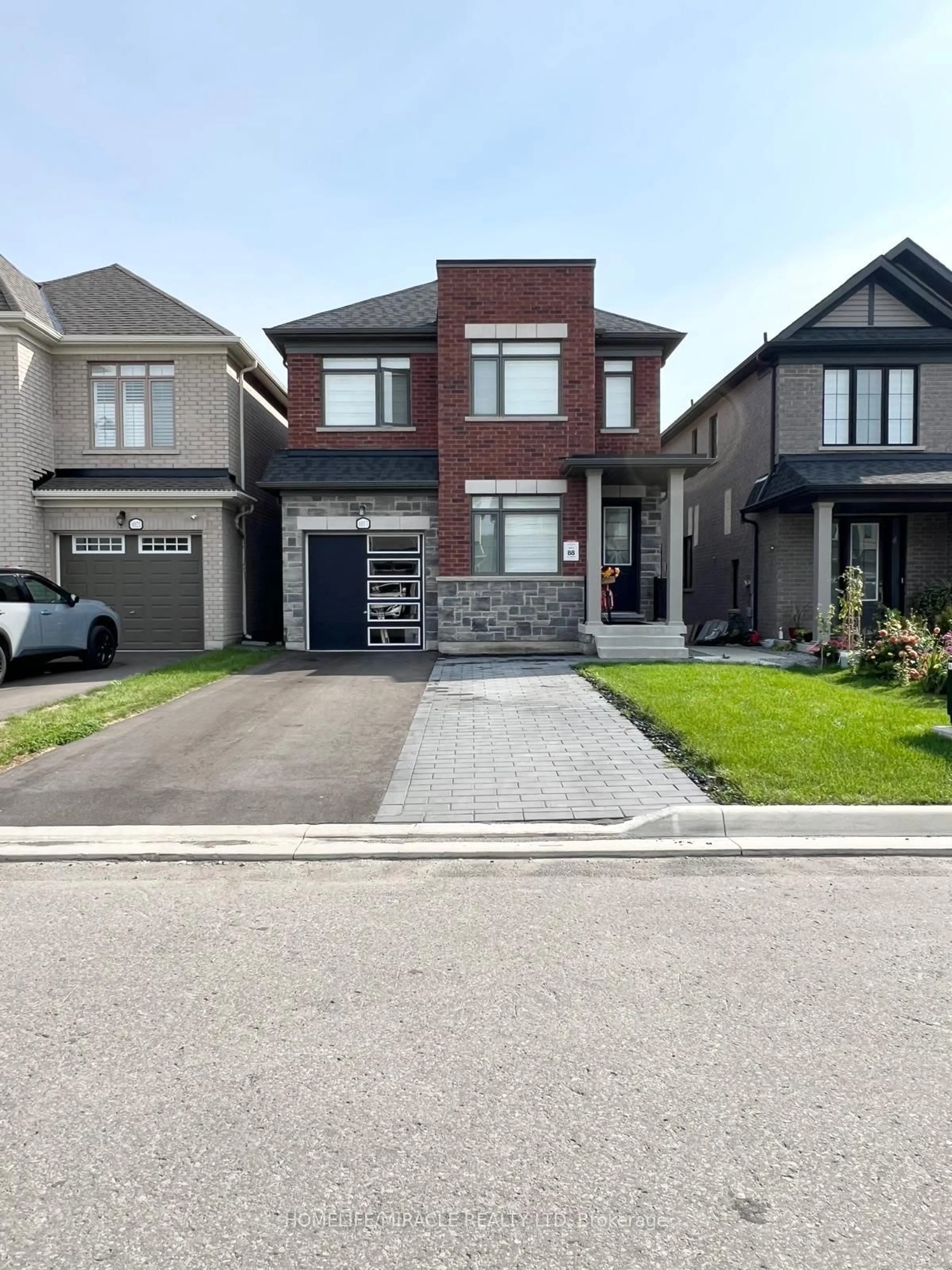 Home with brick exterior material, street for 1017 Lockie Dr, Oshawa Ontario L1L 0S2