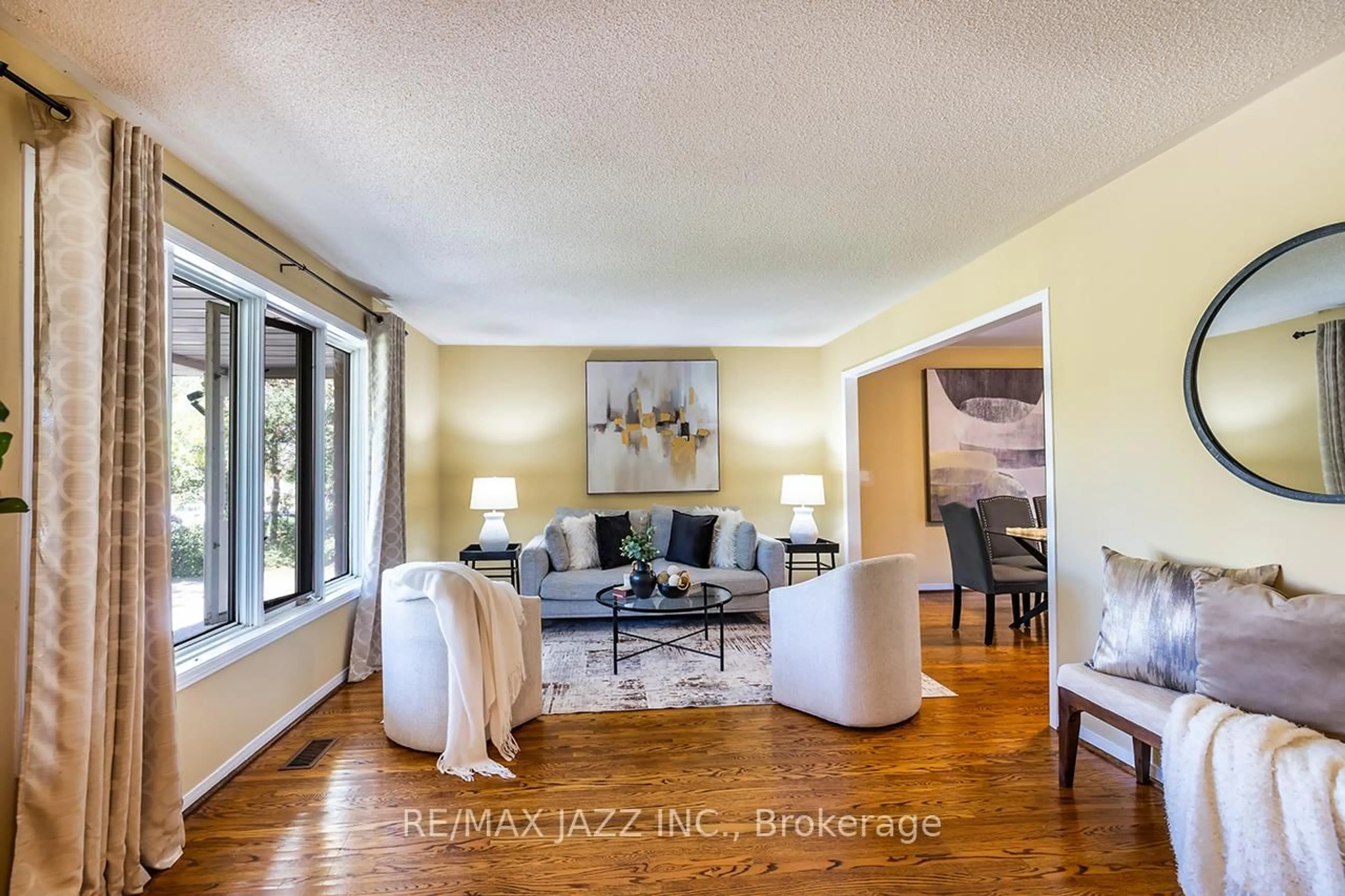 Living room with furniture, wood/laminate floor for 585 Myrtle Rd, Whitby Ontario L0B 1A0