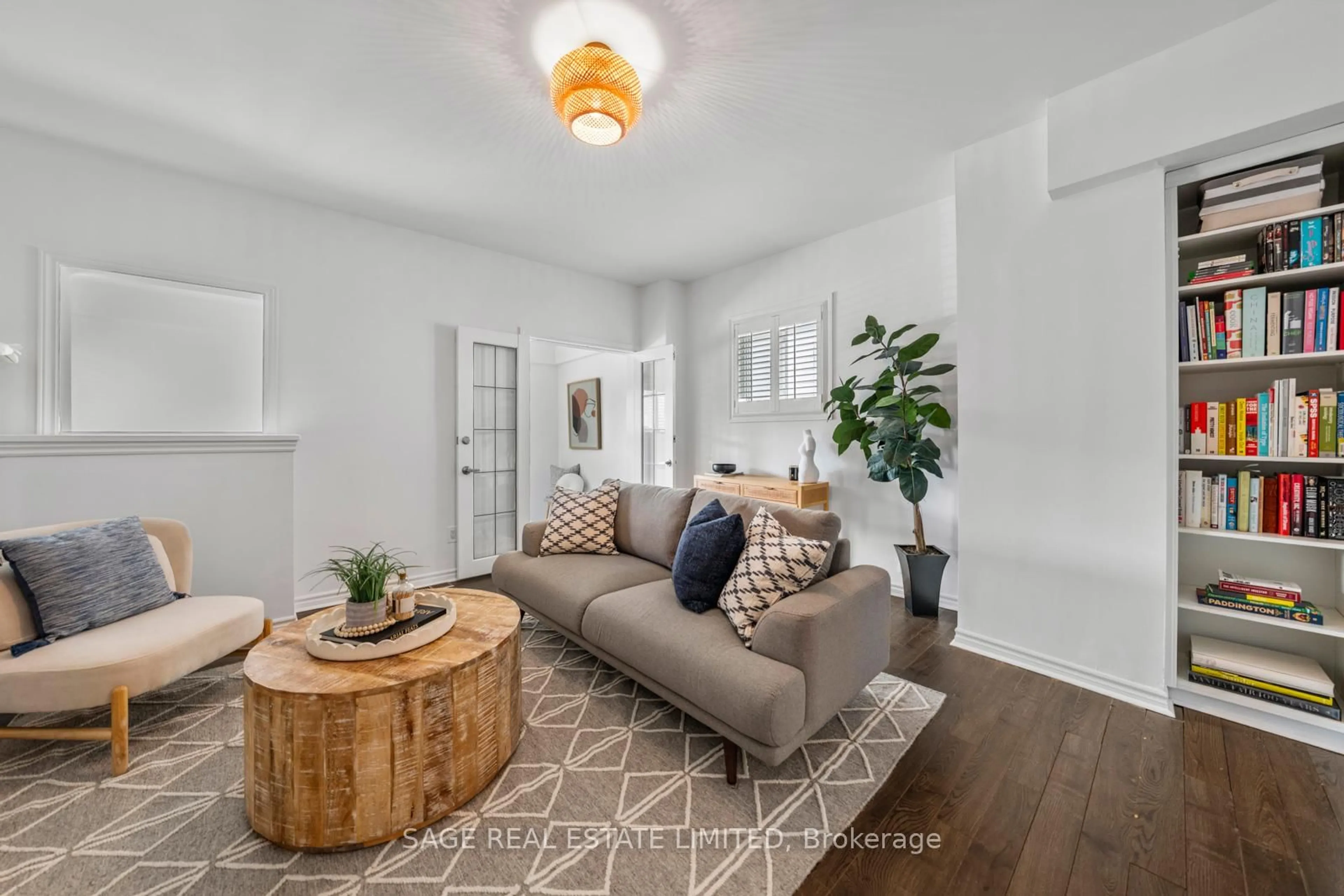 Living room with furniture, wood/laminate floor for 79 Pitt Ave, Toronto Ontario M1L 2R5