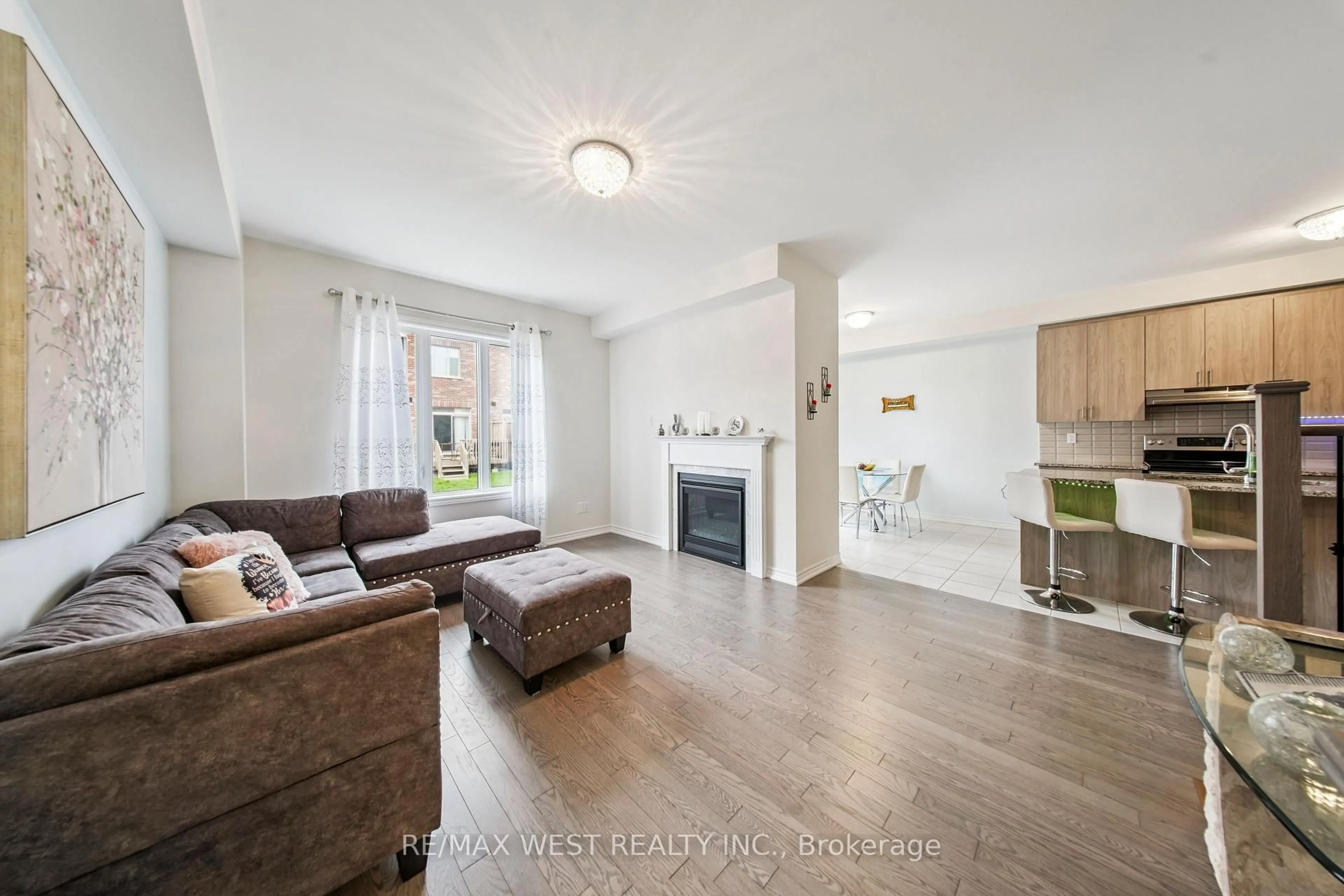 Living room with furniture, wood/laminate floor for 4 Hickling Lane, Ajax Ontario L1T 0N6