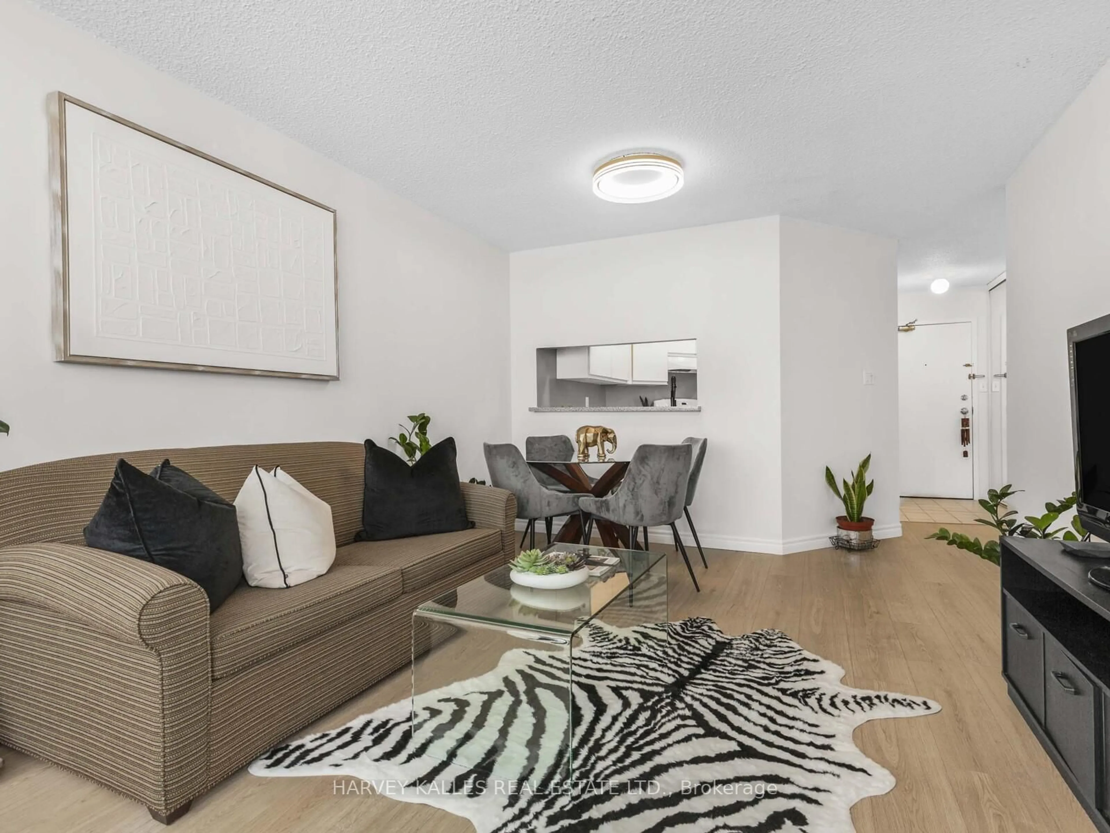 Living room with furniture, unknown for 2550 Lawrence Ave #211, Toronto Ontario M1P 4Z3