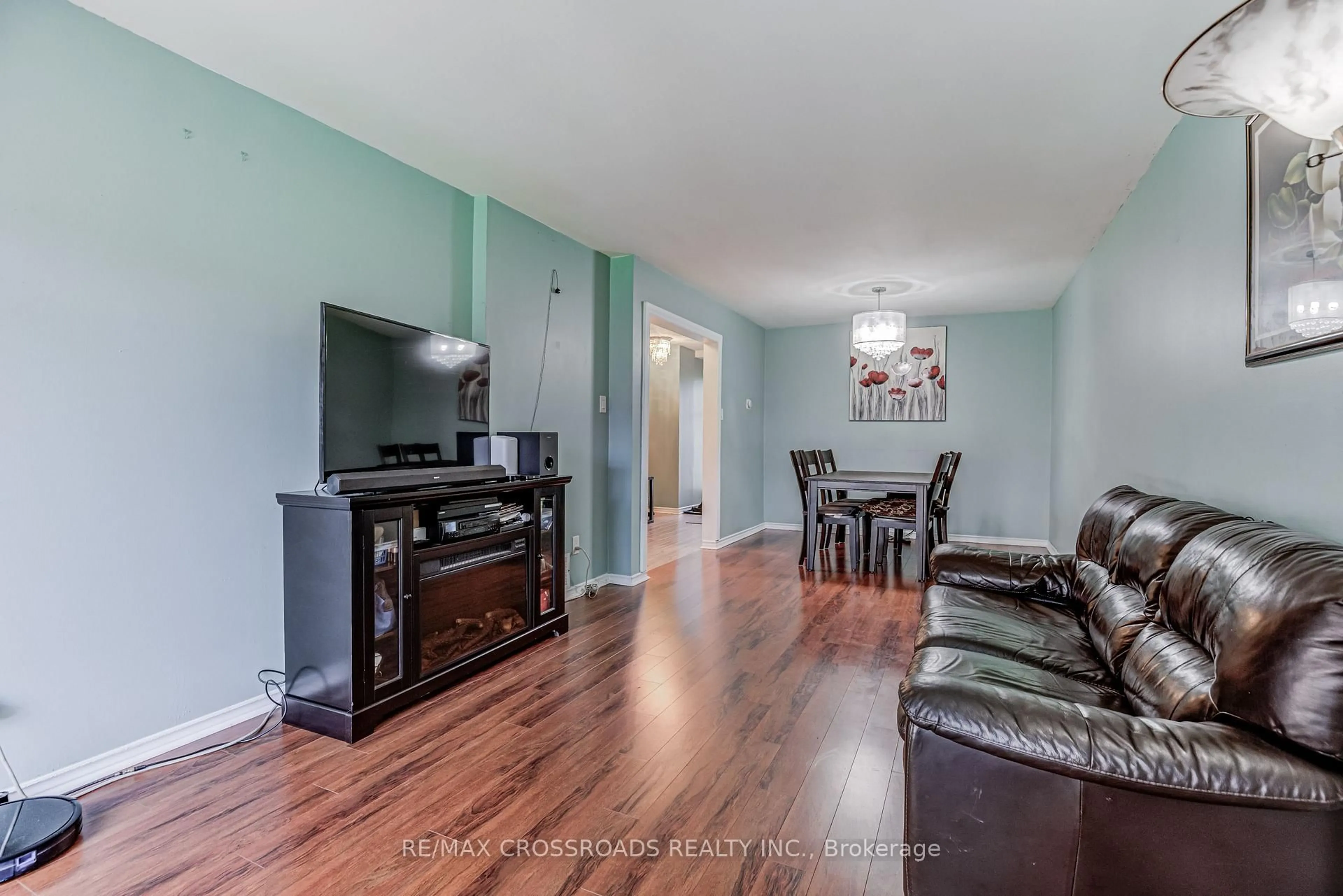Living room with furniture, wood/laminate floor for 15 Lowry Sq, Toronto Ontario M1B 1N7