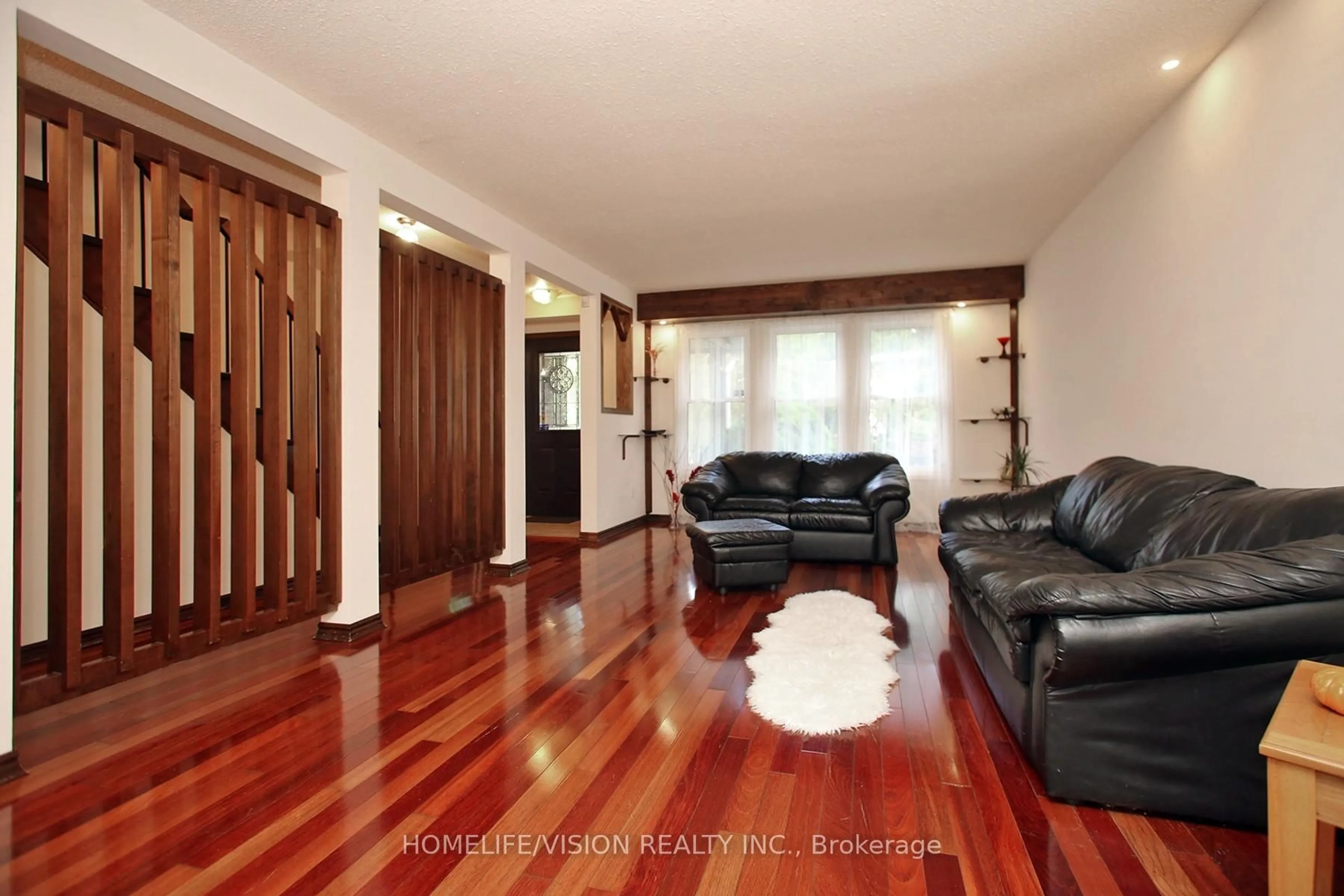 Living room with furniture, wood/laminate floor for 12 Relroy Crt, Toronto Ontario M1W 2Y7