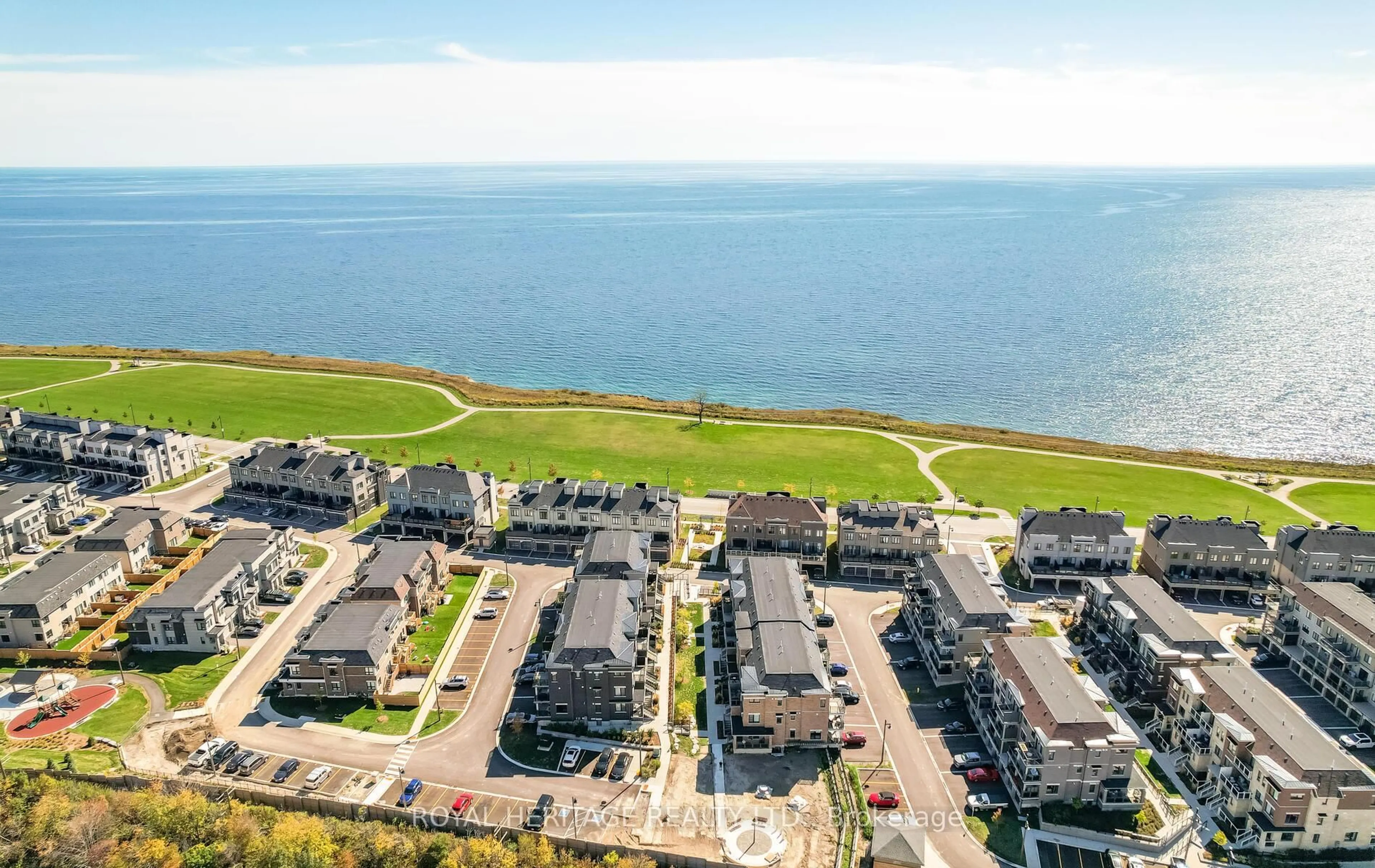 A pic from outside/outdoor area/front of a property/back of a property/a pic from drone, water/lake/river/ocean view for 31 Lookout Dr #D, Clarington Ontario L1C 7G1