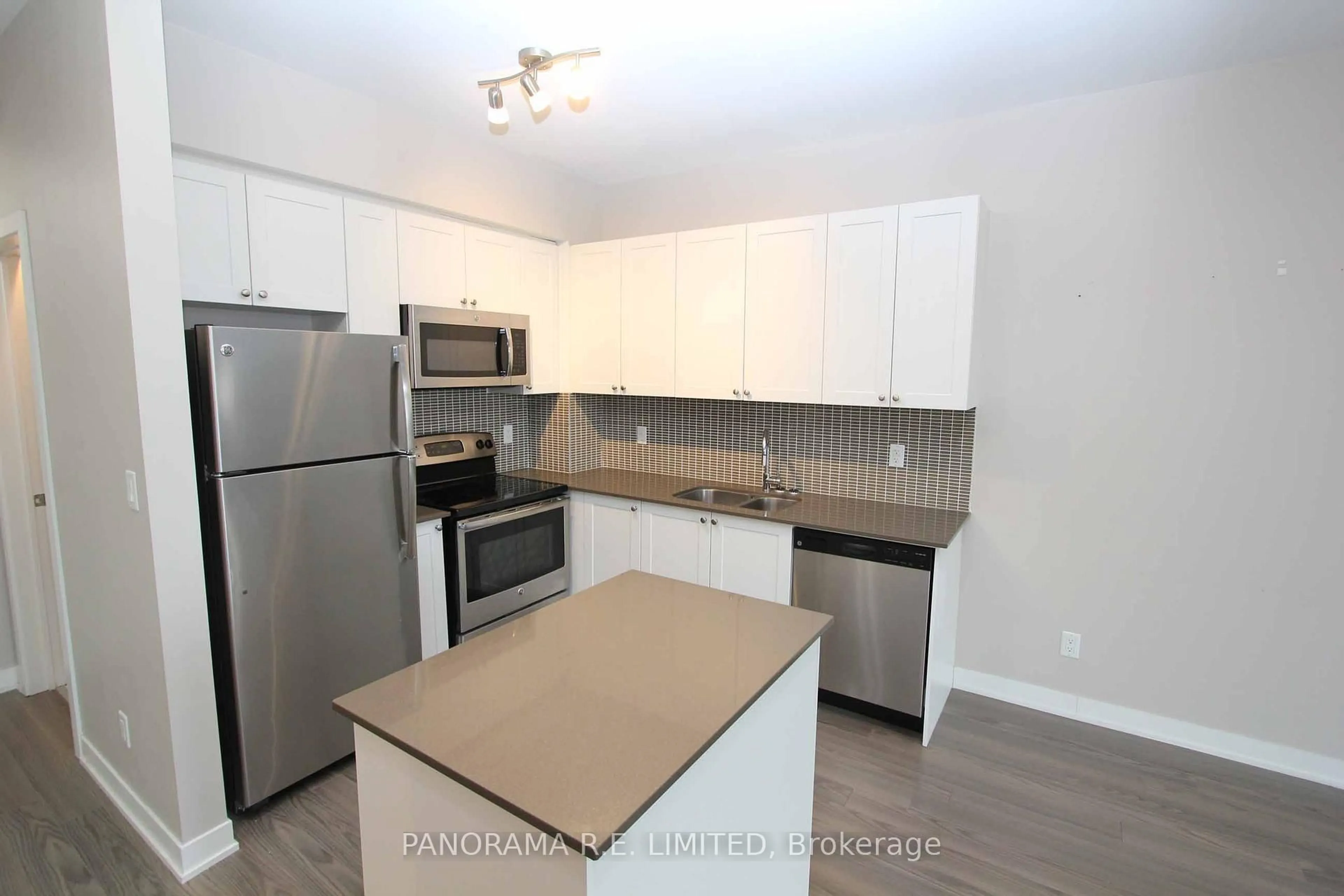 Standard kitchen, wood/laminate floor for 3560 St Clair Ave #318, Toronto Ontario M1K 2A7